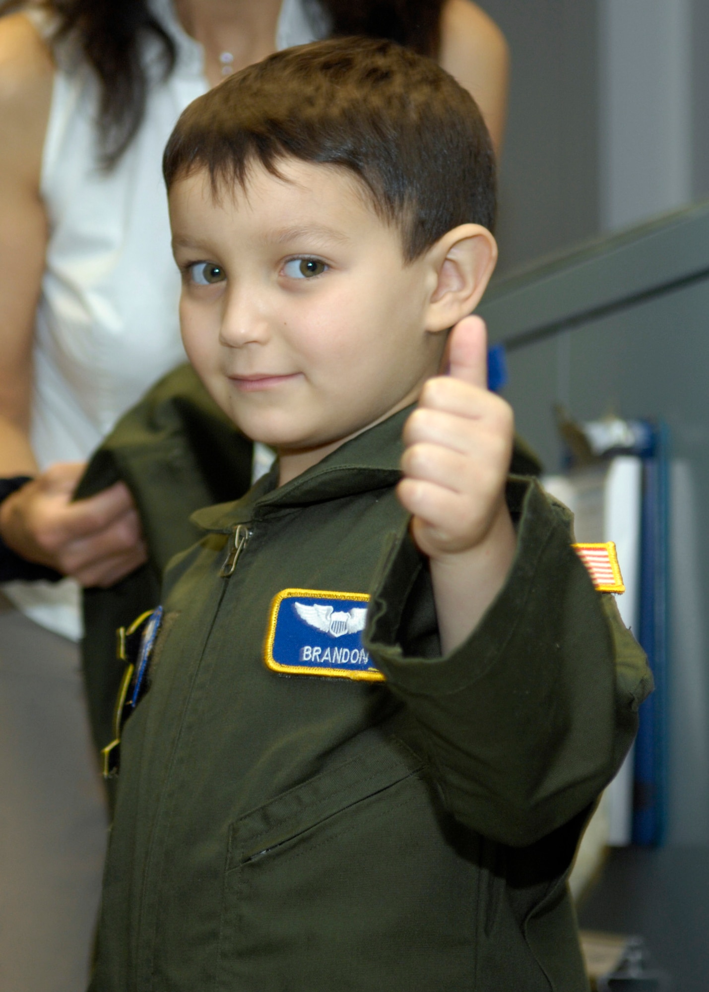 Brandon Leach gives the thumbs up approval for his new flight suit while on tour of the 1st Helicopter Squadron during his "Pilot for the Day" tour of Andrews Air Force Base, Md., on May 16, 2008. (U.S. Air Force photo by Senior Airman Renae Kleckner)(released)