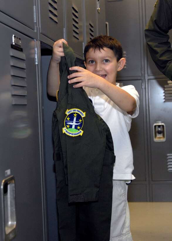 Brandon Leach recieves his very own tailored flight suit while touring the 1st Helicopter Squadron at Andrews Air Force Base, Md., on May 16, 2008. (U.S. Air Force photo by Senior Airman Renae Kleckner)(released)