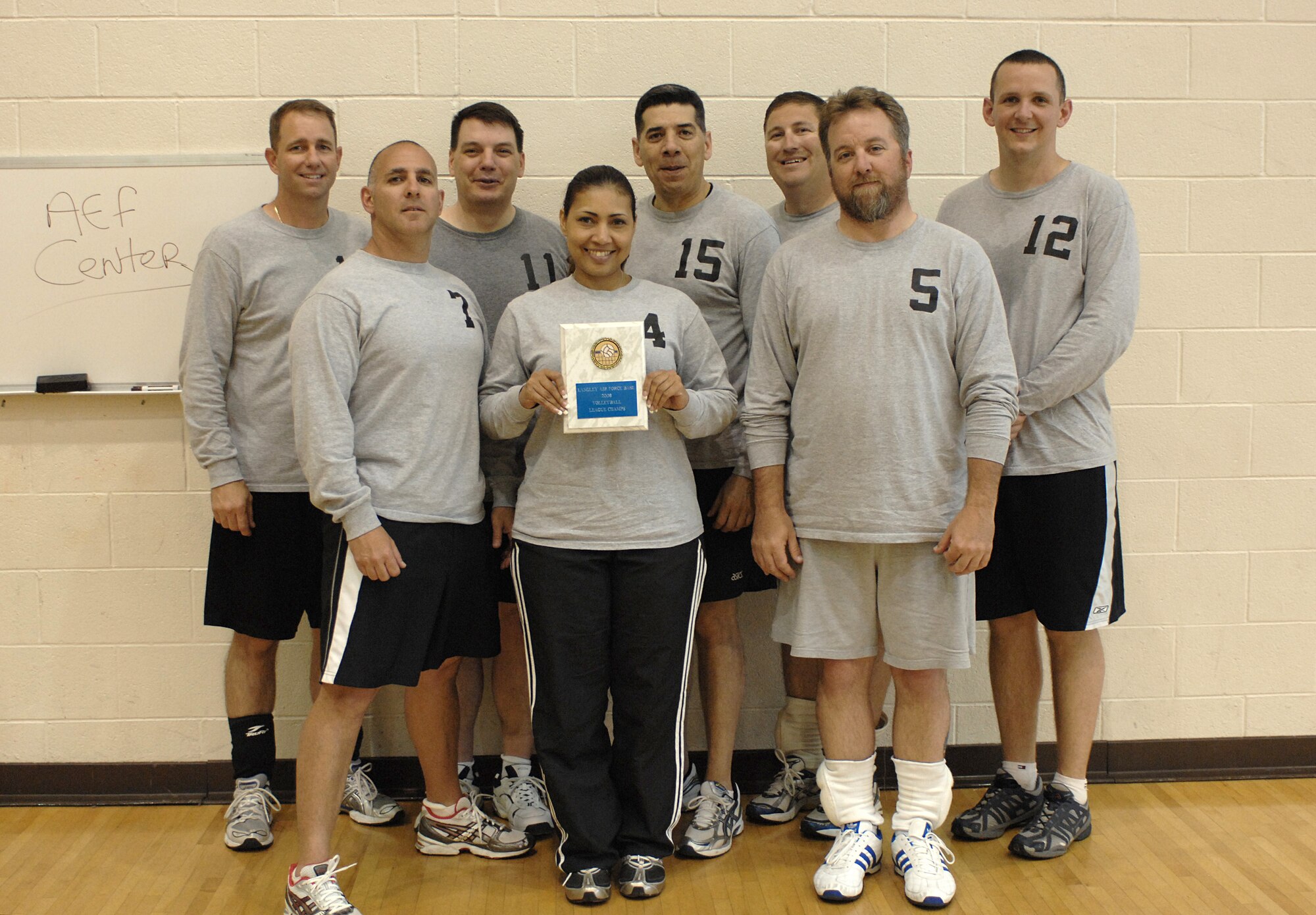 LANGLEY AIR FORCE BASE, Va. -- The Air Expeditionary Force center intramural volleyball team poses for a group photo May 21.  The AEF center team is Langley’s volleyball league champions. (U.S. Air Force photo/Tech. Sgt. April Wickes)