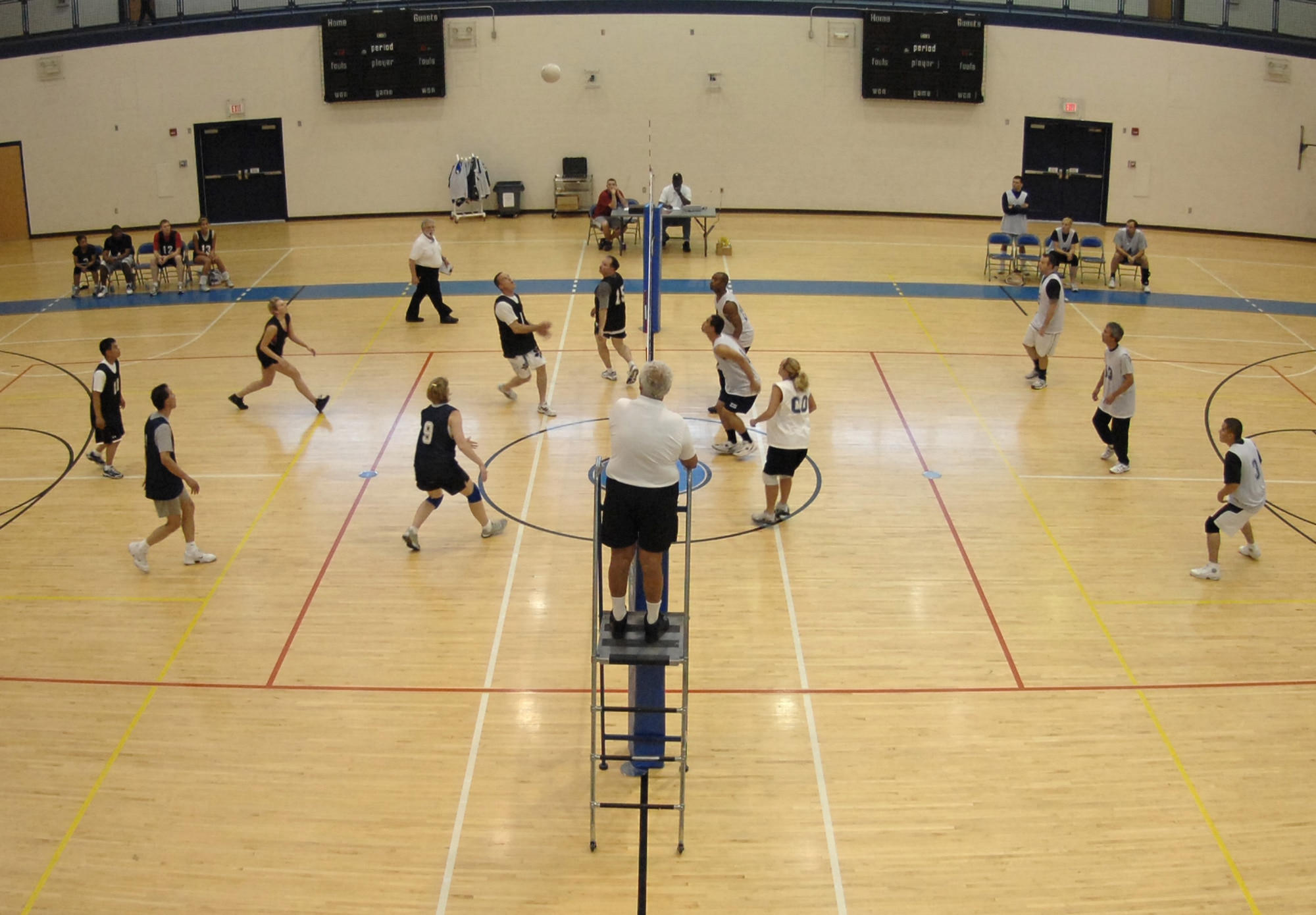 LANGLEY AIR FORCE BASE, Va. -- The Air Combat Command Operations Directorate volleyball team faces off against the 735th Supply Chain Management Group’s team in the intramural championship game May 21. The 735th SCMG won the game 25 to 18 to become Langley’s intramural volleyball champions.  (U.S. Air Force photo/Tech. Sgt. April Wickes)
