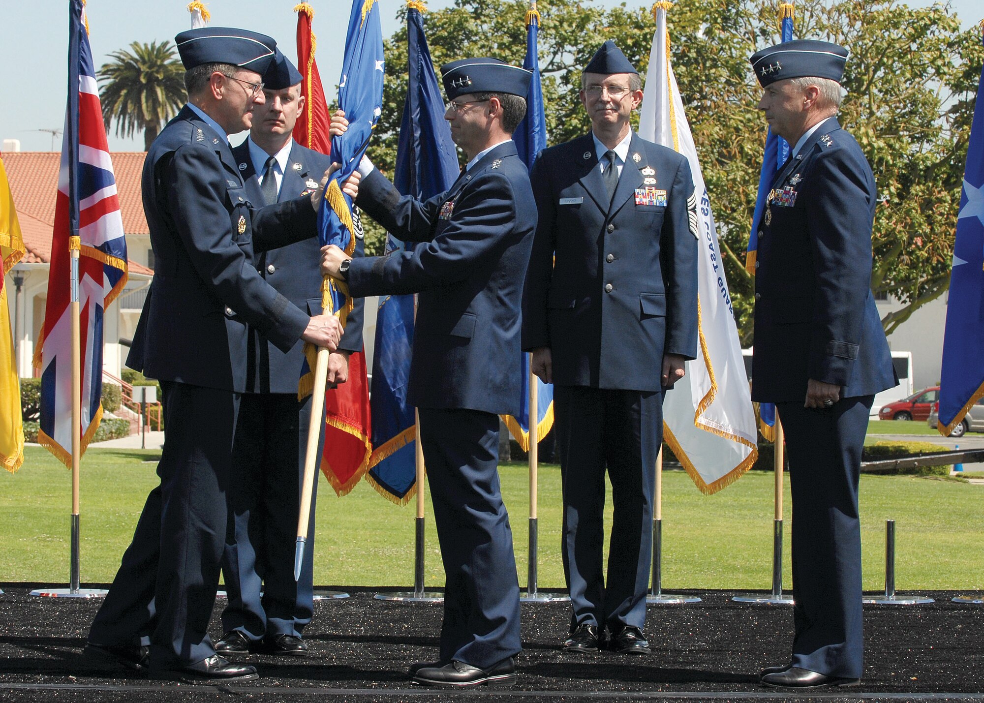 Lt. Gen. John T. 'Tom' Sheridan accepts the SMC guidon from AFSPC Commander, General Robert Kehler signifying his acceptance of command as the new commander of Air Force Space Command's Space and Missile Systems Center. Lt. Gen. Sheridan was formerly Deputy Director of the National Reconnaissance Office.
