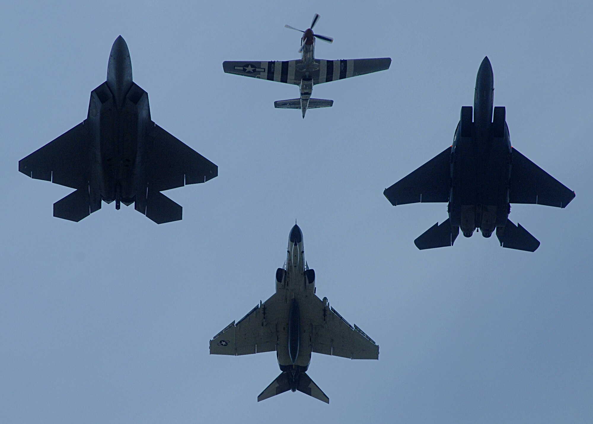 The Air Combat Command Heritage Flight took to the skies over Andrews Air Force Base, Va.,  during the Joint Service Open House May 17.  The Heritage flight consists of a P-51 Mustang (lead), a F-22A Raptor (left), a F-15E Strike Eagle (right) and an F-4 Phantom.  The F-4s used in the Heritage flights are owned and operated by the 82nd Aerial Targets Squadron from Tyndall Air Force Base, Fla.  Photo by Amn Melissa Rodrigues.