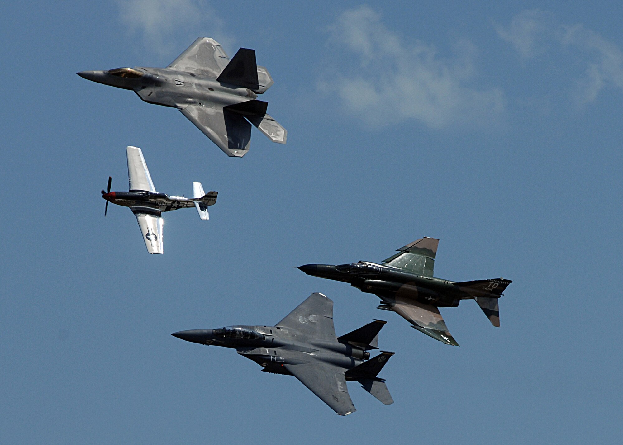 The Air Combat Command Heritage Flight took to the skies over Andrews Air Force Base, Va.,  during the Joint Service Open House May 17.  The Heritage flight consists of a P-51 Mustang (lead), a F-22A Raptor (top), a F-15E Strike Eagle and an F-4 Phantom.  The F-4s used in the Heritage flights are owned and operated by the 82nd Aerial Targets Squadron from Tyndall Air Force Base, Fla.  Photo by Amn Melissa Rodrigues.