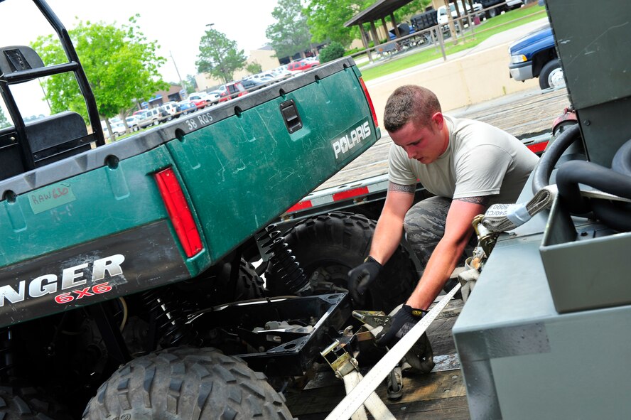 MOODY AIR FORCE BASE, Ga. -- Airman 1st Class Patrick O’Brien, 23rd Logistics Readiness Squadron vehicle operator journeyman, secures equipment here May 21. The 23rd Wing exercised its ability to move cargo via air and road routes to support humanitarian relief missions. (U.S Air Force photo by Senior Airman Schelli Jones) 
