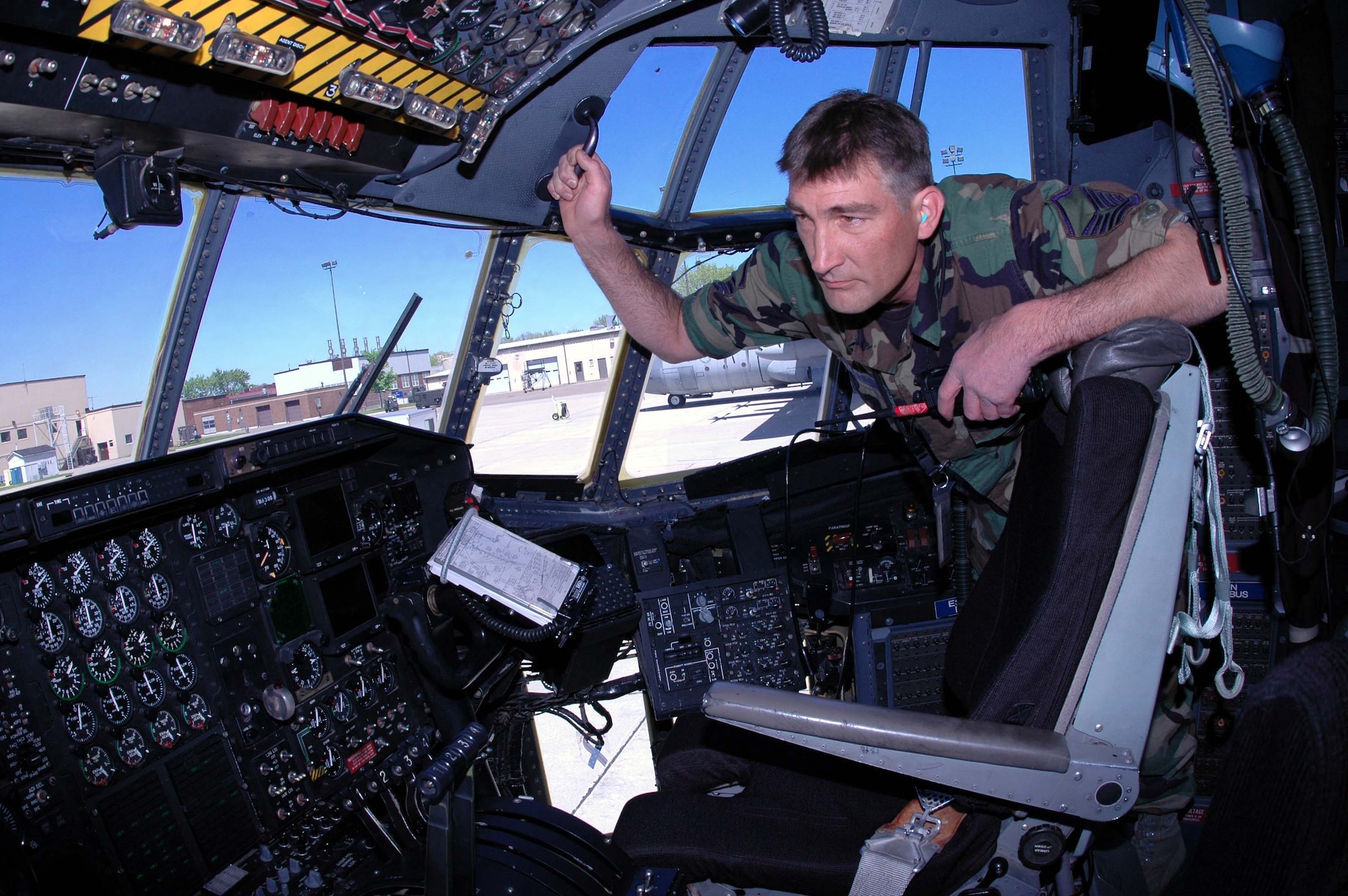 MINNEAPOLIS-ST. PAUL AIR RESERVE STATION, MINN ? Master Sgt. Todd Kopperud, takes a first look at the new C-130?s (H3 model) cockpit after it arrived here from the 914th Airlift Wing at Niagara Falls Air Reserve Station, N.Y.  Most of the differences between the current H2 model and the new H3 are with the new aircraft?s upgraded avionics. Air Force Photo/Master Sgt. Paul Zadach



