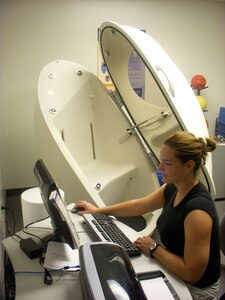 Laura Markuly runs a diagnostics check on the Bod Pod for an upcoming appointment at the Health and Wellness Center May 20. The Bod Pod is open for use on Wednesdays after making an appointment. Ms. Markuly is a Health and Wellness Center Exercise Physiologist (U.S. Air Force photo by Airman 1st Class Timothy Taylor)
