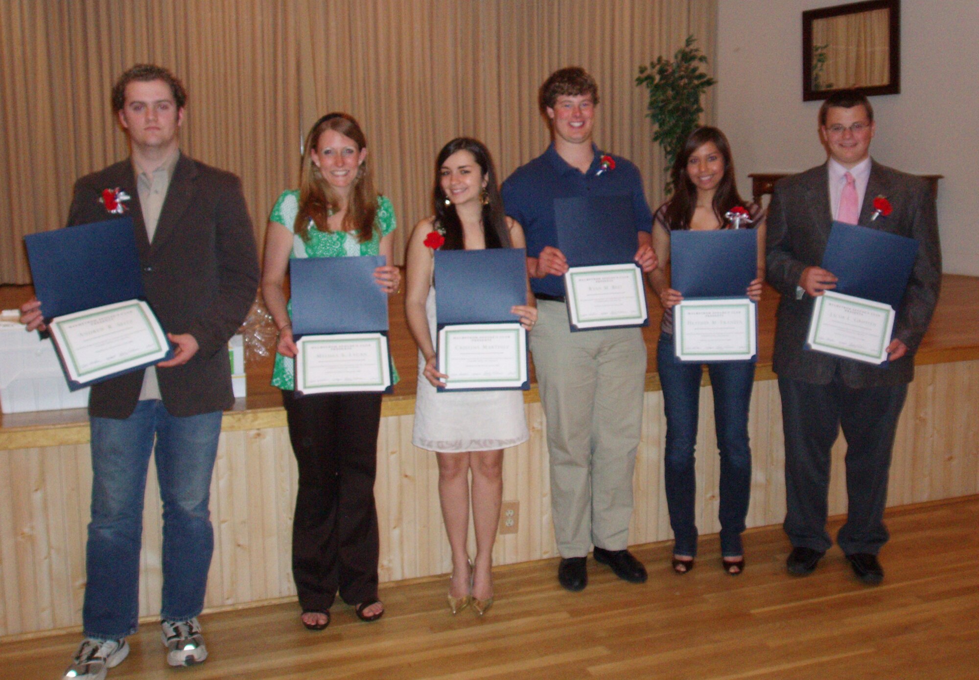 Winners of educational scholarships sponsored by the Malmstrom Spouse's Club pose with ther certificates presented at an awards dinner May 15. (Courtesy photo)