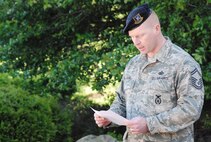 YOUNGSTOWN AIR RESERVE STATION, Ohio - 910th Airlift Wing Security Forces Senior Master Sgt. Eric Stere reads the names of Security Forces Airmen killed in action since September 2005. Ten names were read in all. U.S. Air Force photo by Mr. Eric M. White 