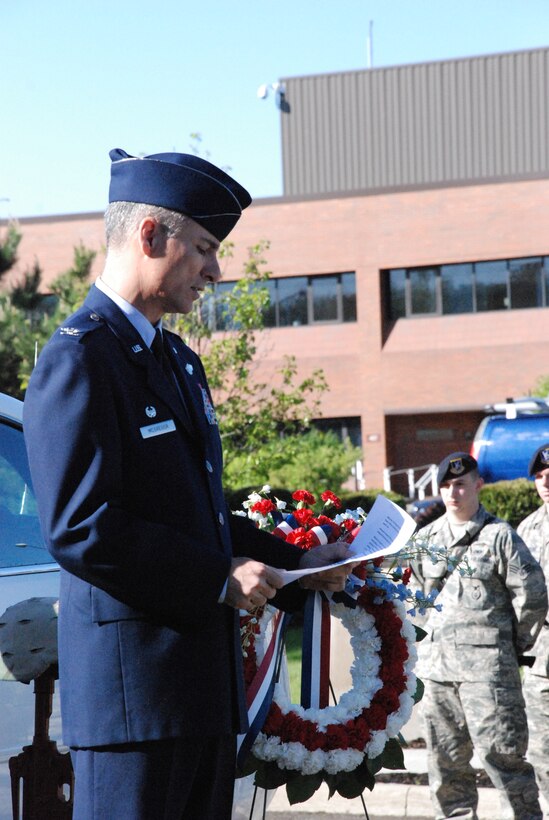 YOUNGSTOWN AIR RESERVE STATION, Ohio - Air Force Reserve Col. Karl McGregor reads the National Police Week Proclamation in honor of National Peace Officers Memorial Day as 910th Security Forces Squadron members observe. U.S. Air Force photo by Mr. Eric M. White