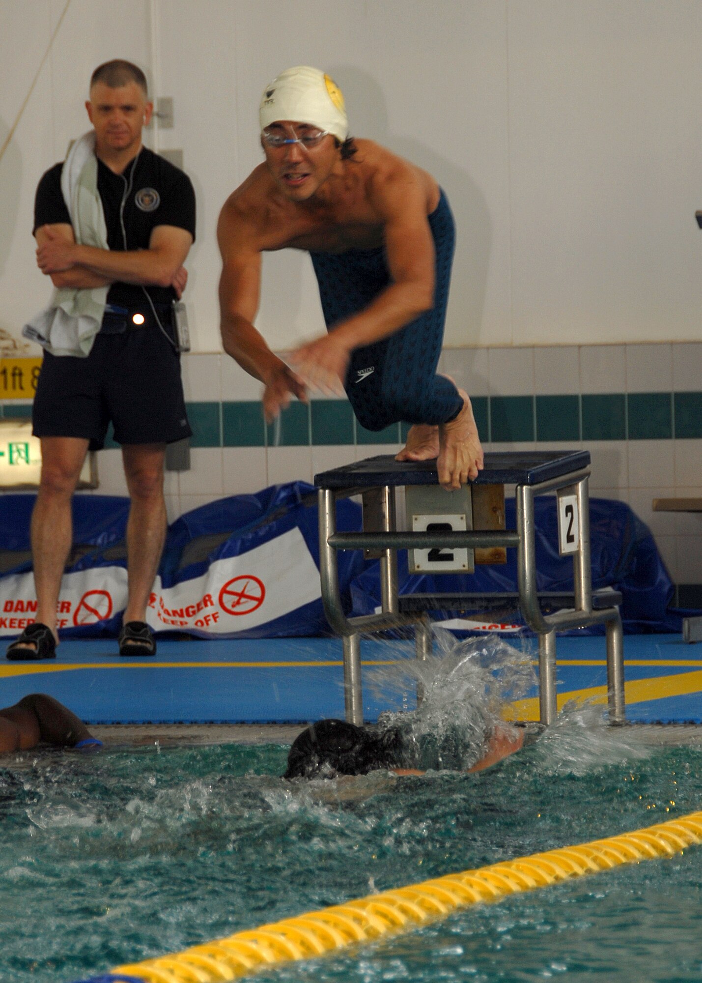 YOKOTA AIR BASE, JAPAN -- Members from the 374th Airlift Wing compete in a swim medley to support their squadron in this year's annual Wing Sports Day. This event gives Airman here a chance to relax and compete in a number of events such as swimming, basketball, golf and softball. (U.S. Air Force photo by SrA Laszlo Babocsi)