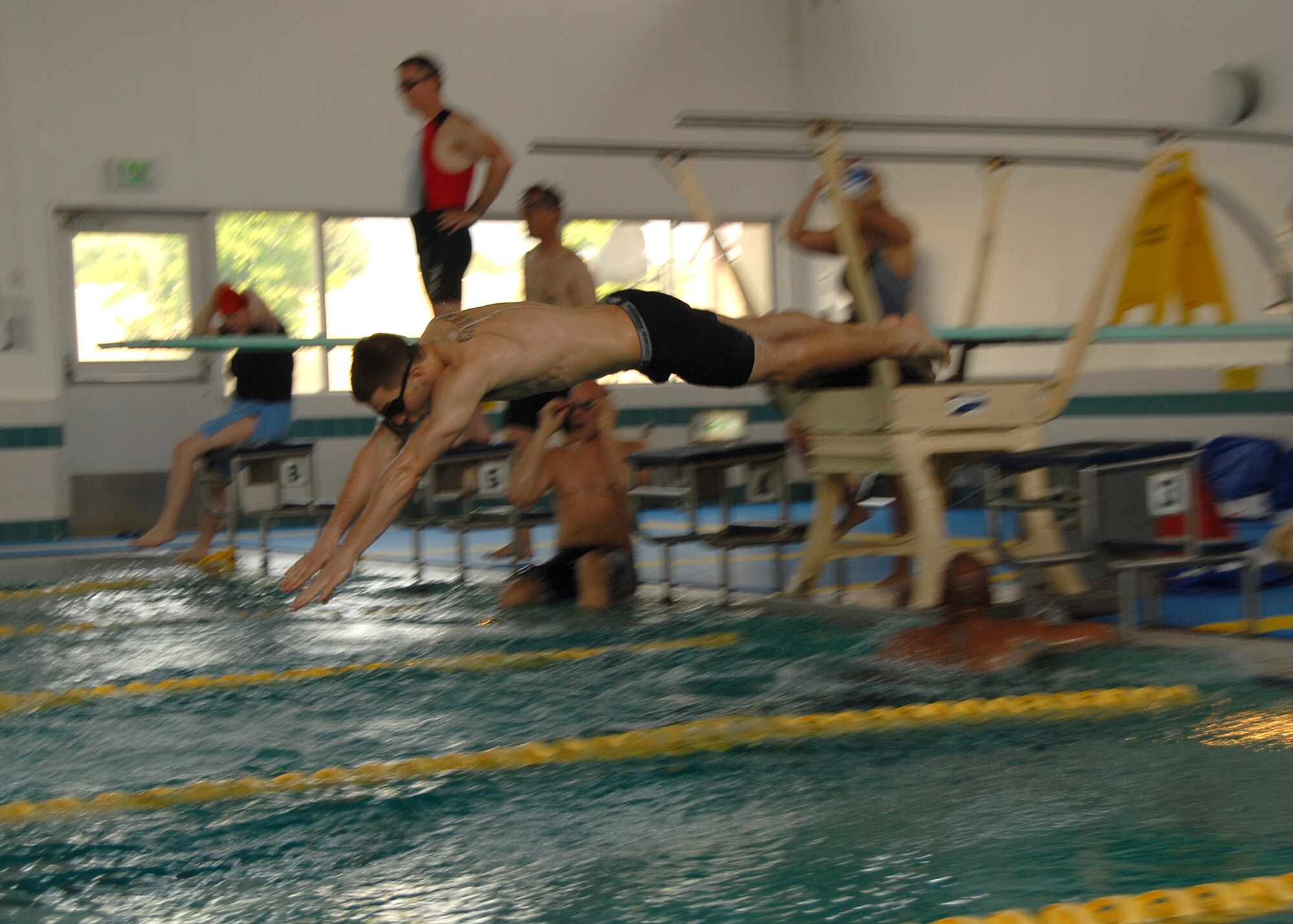 YOKOTA AIR BASE, JAPAN -- Members from the 374th Airlift Wing compete in a swim medley to support their squadron in this year's annual Wing Sports Day. This event gives Airman here a chance to relax and compete in a number of events such as swimming, basketball, golf and softball. (U.S. Air Force photo by SrA Laszlo Babocsi)