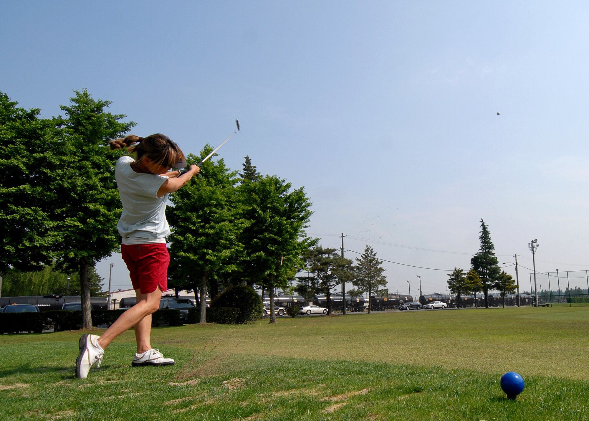 YOKOTA AIR BASE, JAPAN -- Kaz Mamiya from the 374th Civil Engineering Squadron tee's off in the "Best Ball" golf tournament in this year's annual Wing Sports Day. This event gives Airman here a chance to relax and compete in a number of events such as swimming, basketball, golf and softball. (U.S. Air Force photo by SrA Laszlo Babocsi)