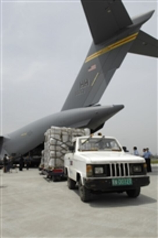 Service members unload disaster relief supplies delivered by two U.S. Air Force C-17 Globemaster III aircraft at Shuangliu International Airport in Chengdu, China, on May 18, 2008. U.S. Pacific Command is supporting relief efforts following a powerful earthquake that struck southwestern China on May 12.  
