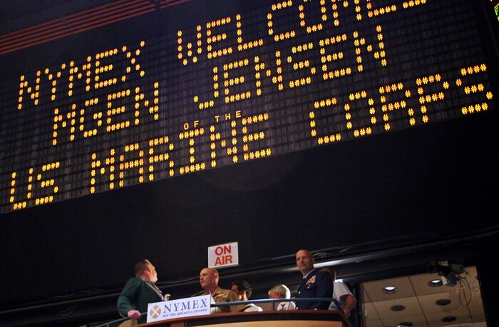 Major Gen. Carl Jensen, center, the deputy commander of Marine Forces Command, rings the electronic bell signaling the opening of the Market at New York Mercantile Exchange in New York City May 22. Shortly after the opening, trading stopped and for a 10-minute ovation for Jensen and his service member entourage.::r::::n::