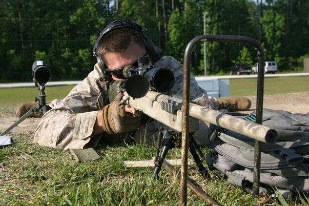 Marine with Special Operations Advisor Group, U.S. Marine Corps Forces, Special Operations Command sights in on his target during the scoped weapons course here, May 22. This course is part of the weapons subject matter expert course that certain MSOAG initial training pipeline students must complete before being assigned to a Marine Special Operations Team.