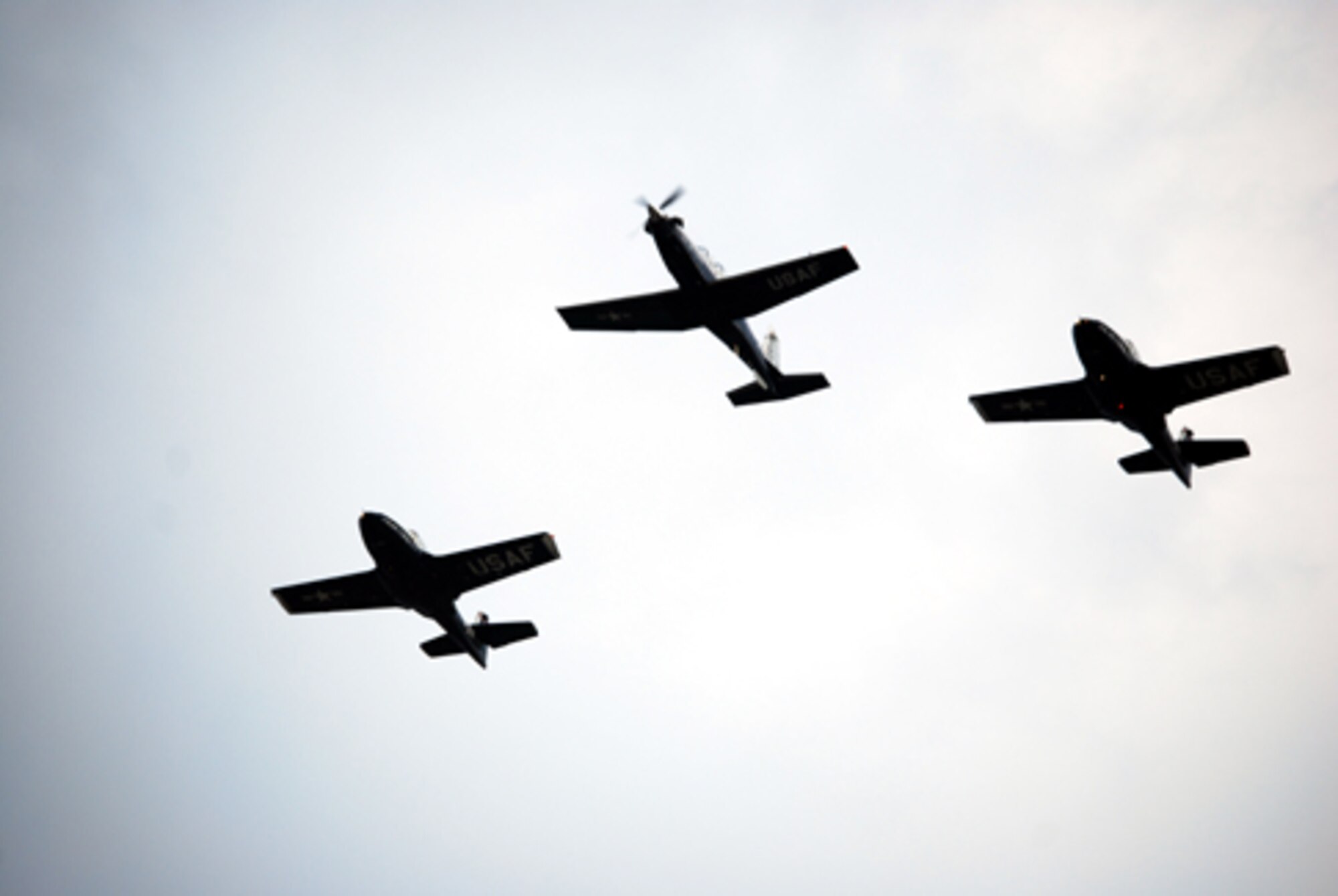 A T-6A texan II and two T-37 Tweets flyover the parade feild during the Armed Forces Day Parade May 23 . The parade started Sheppard's Armed Forces Day events, which culminated with a luncheon. (U.S. Air Force photo/Airman 1st Class Jacob Corbin)