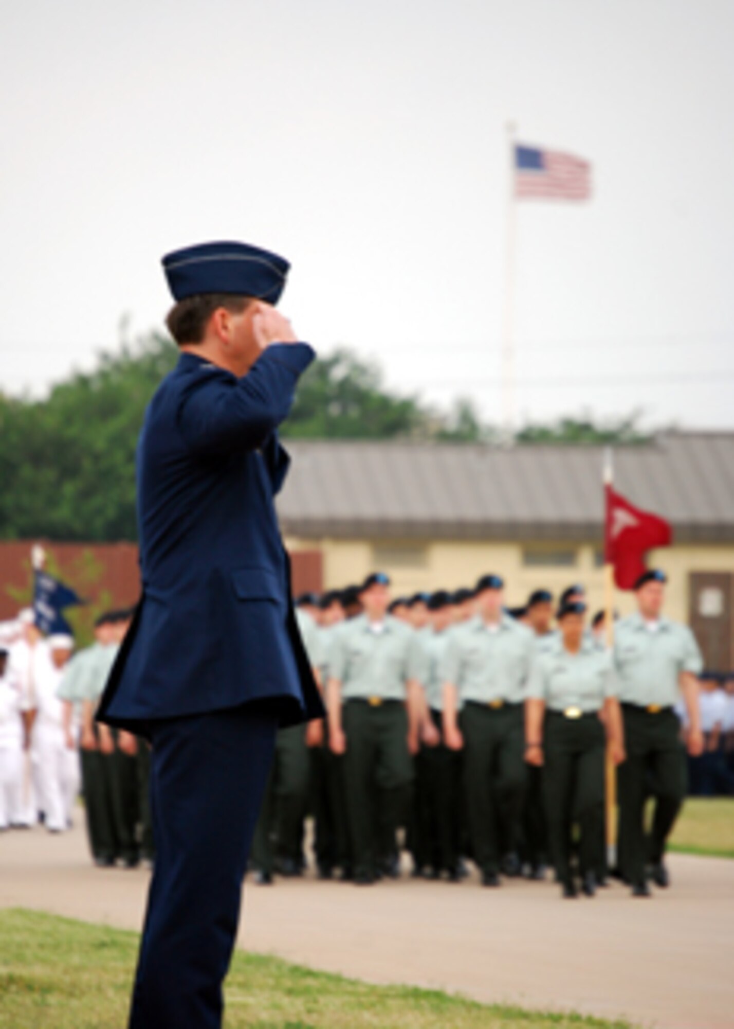 Col. Andrew Cain, the 782nd Training Group commander, salutes troops passing the reviewing stand in the Armed Forces Day Parade May 23. The parade started Sheppard's Armed Forces Day events, which culminated at a luncheon.(U.S. Air Force photo/Airman 1st Class Jacob Corbin)