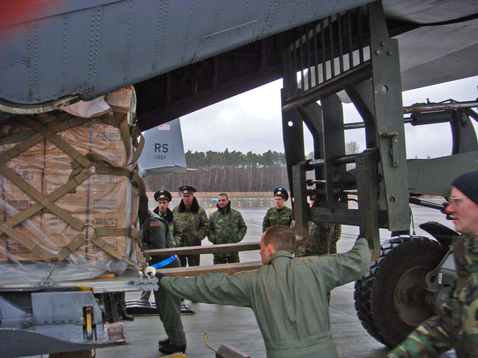 Airmen from the 86th Airlift Wing demonstrate C-130 Hercules uploading operations with visiting Russian Air Force delegation members in November at Ramstein Air Base., Germany. (U.S. Air Force photo)                 
