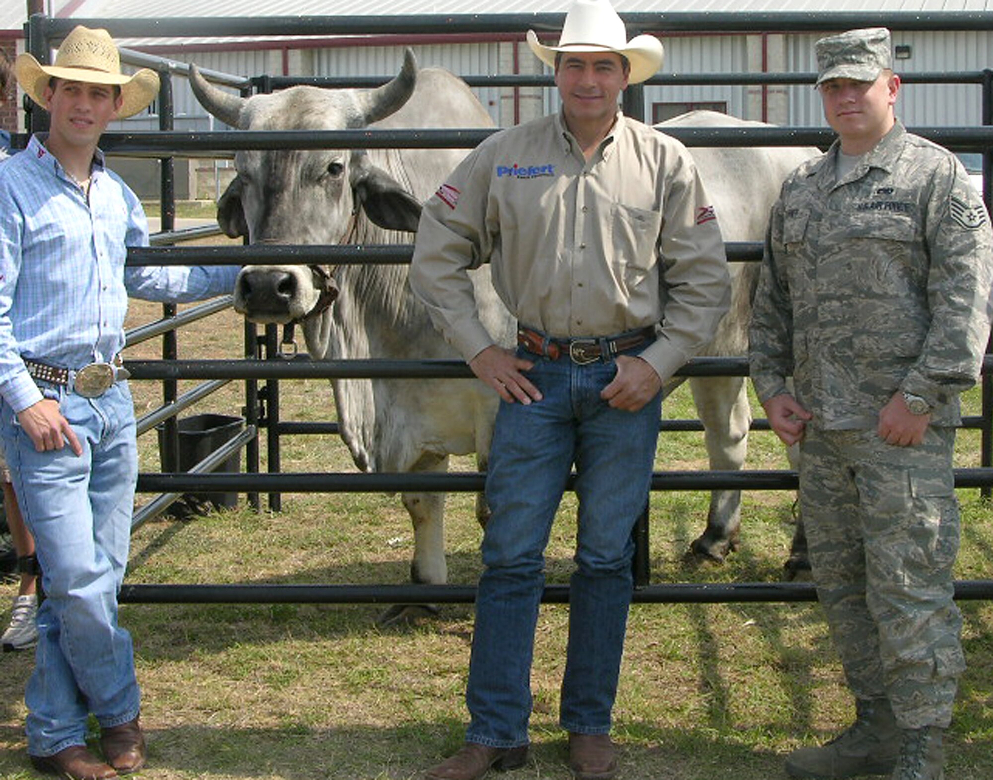 Professional Bull Riders stars McKennon Wimberly, left, Adriano Moraes, center, and Buckshot, PBR’s official mascot bull, pause for a photo with Air Force Recruiter Staff Sgt. William Turner during a visit at Medina Valley High School in Castroville, Texas. The U.S. Air Force began its first year of PBR sponsorship May 17 with the season opening competition in the San Antonio, Texas, Alamodome. In addition to school visits, the partnership provides the Air Force the opportunity to advertise at PBR events and share Air Force information with fans. Sergeant Turner is a member of the 341st Recruiting Squadron. (Courtesy photo)