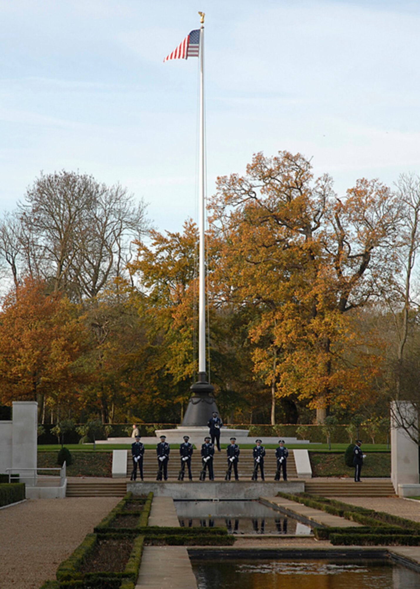 Members of the RAF Lakenheath Honor Guard stand and pay tribute to those who lost their lives fighting for the freedom of others at Madingley Cemetery in Cambridge, England. (U.S. Air Force photo by Senior Airman Brian J. Ellis)