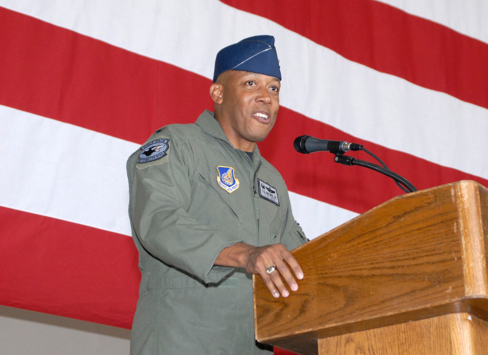 KUNSAN AIR BASE, Republic of Korea -- Colonel CQ Brown, former 8th Fighter Wing commander, addresses the wing and fellow Wolf Pack members during the wing change of command ceremony here May 23. Colonel Brown expressed his gratitude and thanked the Wolf Pack for their hard work and dedication to the mission. Colonel Brown is headed to the Pentagon in Washington. (U.S. Air Force photo/Senior Airman Dana D. Hill)
