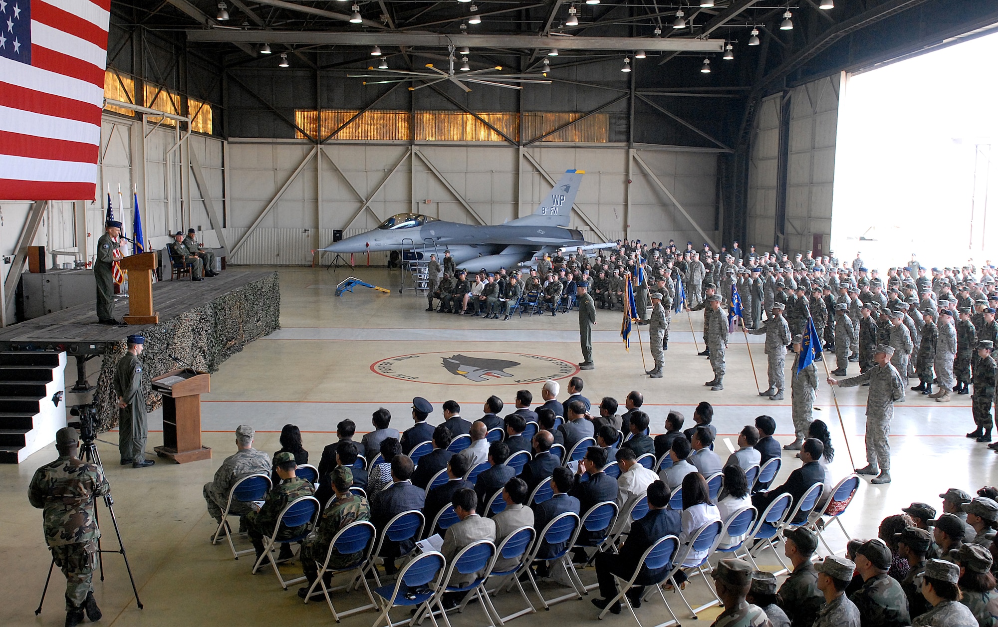 KUNSAN AIR BASE, Republic of Korea -- Colonel James “Wolf” Bearden, 8th Fighter Wing commander, speaks to members of the 8th Fighter Wing at Hanger 3 during the wing’s change of command ceremony here May 23. Members of the Wolf Pack witnessed Col. CQ Brown, former 8th Fighter Wing commander, relinquish command to Colonel Bearden. (U.S. Air Force photo/Senior Airman Giang Nguyen) 