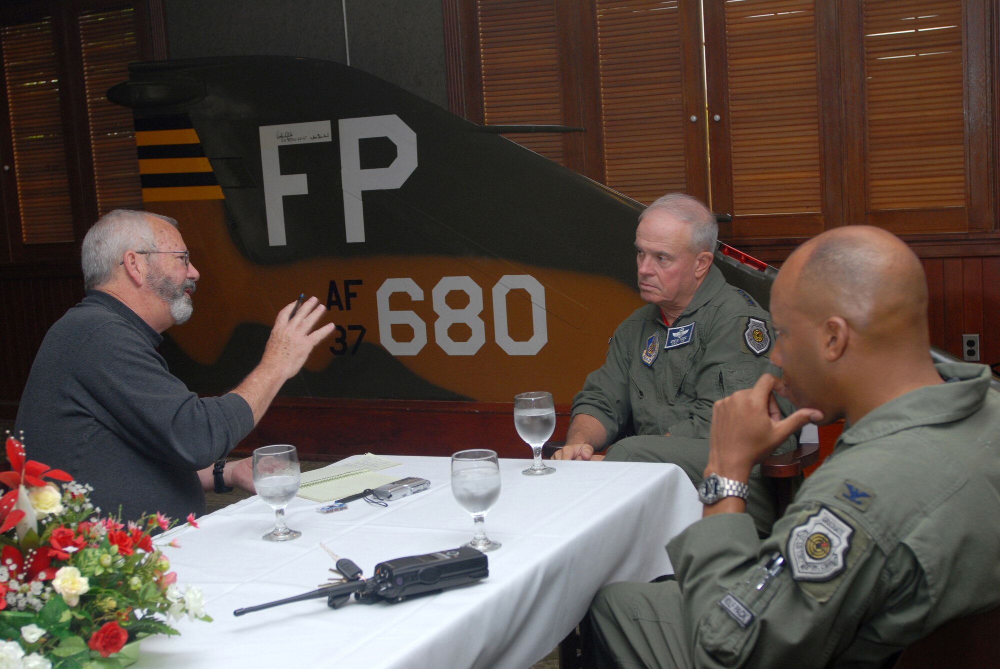 KUNSAN AIR BASE, Republic of Korea- Colonel CQ Brown observes while Mr. Dave Fulghum interviews Lt. Gen. Stephen Wood here May 23. Colonel Brown is the former commander of the 8th Fighter Wing, Mr. Fulghum is a Reporter from Aviation Week magazine, and General Wood is commander of 7th Air Force, Air Forces Korea.(U.S. Air Force photo/Senior Airman Angela Ruiz)
