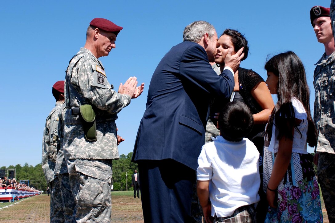 President George W. Bush comforts Erika Wyckoff after accepted her husband's Silver Start in a ceremony on Fort Bragg, N.C., May 22, 2008. Sgt. Charles Wyckoff was assigned to the 82nd Airborne Divisions' 3rd Platoon, Company C, 1st Battalion, 508th Parachute Infantry Regiment, 4th Brigade Combat Team. He was honored for his actions June 6, 2007, during Operation Enduring Freedom. While engaged in close combat, Wyckoff revealed his position fatally engaging two insurgents to save the lives of his platoon. 

