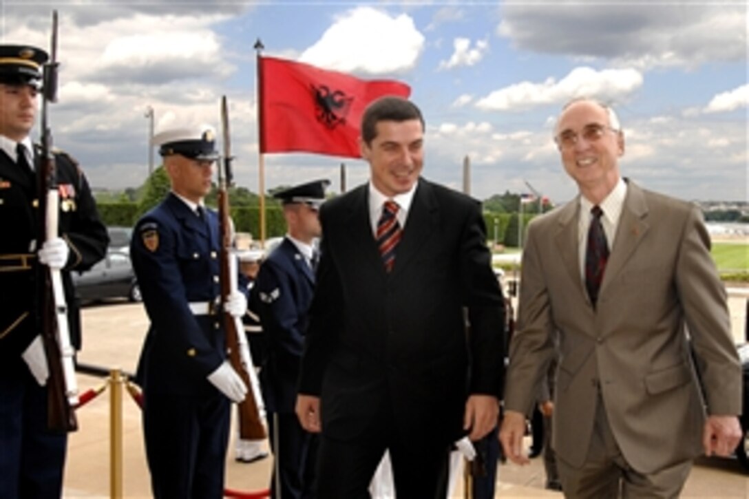 U.S. Deputy Defense Secretary Gordon England, right, escorts Albanian Minister of Defense Gazmend Oketa through an honor cordon into the Pentagon, May 22, 2008.  The two defense leaders will discuss a broad range of regional security issues.  