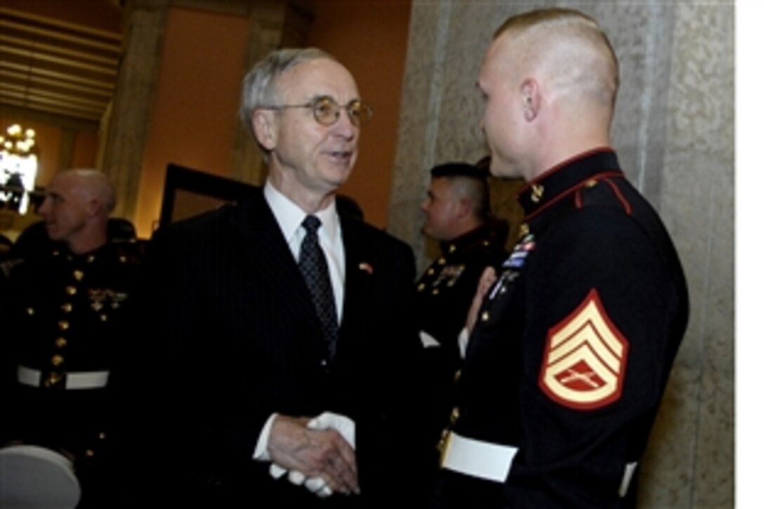 Deputy Defense Secretary Gordon England thanks a Marine for his service during the Lima Company Memorial ceremony at the Ohio Statehouse in Columbus, Ohio, May 23, 2008.  