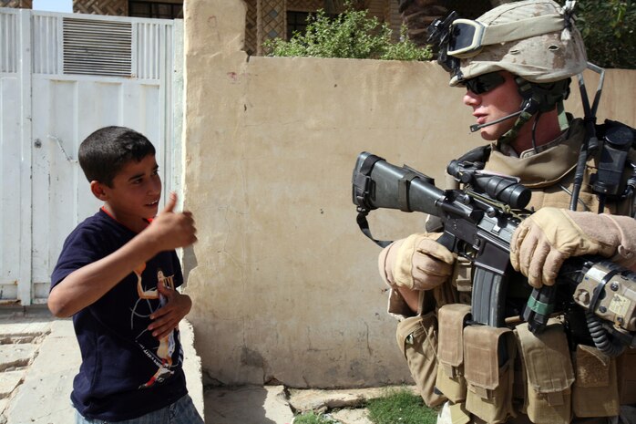 RAMADI, Iraq (July 4, 2008) Cpl. Chris Sarlo, a rifleman with Weapons Company, 1st Battalion, 9th Marine Regiment, Regimental Combat Team 1, receives a thumbs up from young citizen in Ramadi May 23. The city of Ramadi was once-considered the most violent city in Iraq. But now, the locals have revolted against al Qaeda and are cooperating with Coalition forces to weed out al Qaeda in the province. (Official U.S. Marine Corps photo by Lance Cpl. Casey Jones) (RELEASED)