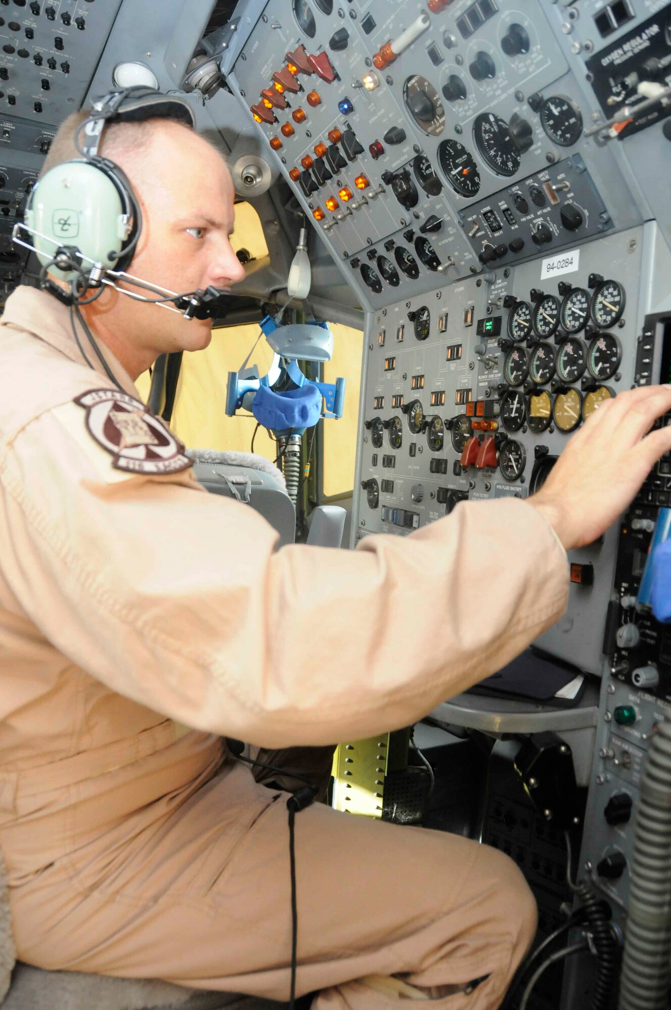 SOUTHWEST ASIA—Tech. Sgt. Mike Arnold, 7th Expeditionary Airborne Command and Control Squadron, performs pre-flight checks inside the cockpit of a modified Boeing 707 May 19. (U.S. Air Force photo/ Senior Airman Domonique Simmons)