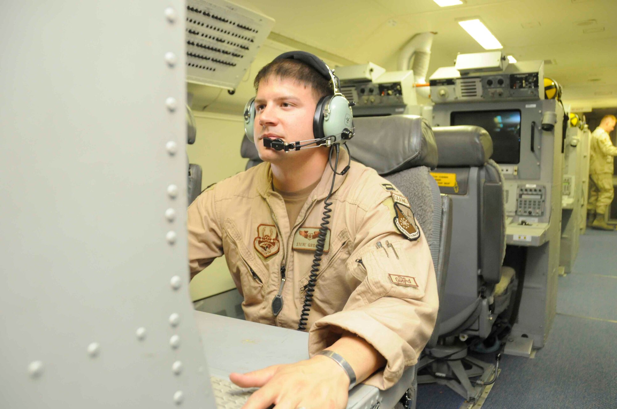 SOUTHWEST ASIA – Capt. Steve Grogan, 7th Expeditionary Airborne Command and Control Squadron senior director, controls an operator work station inside a Joint STARS aircraft May 19. (U.S. Air Force photo/ Senior Airman Domonique Simmons)