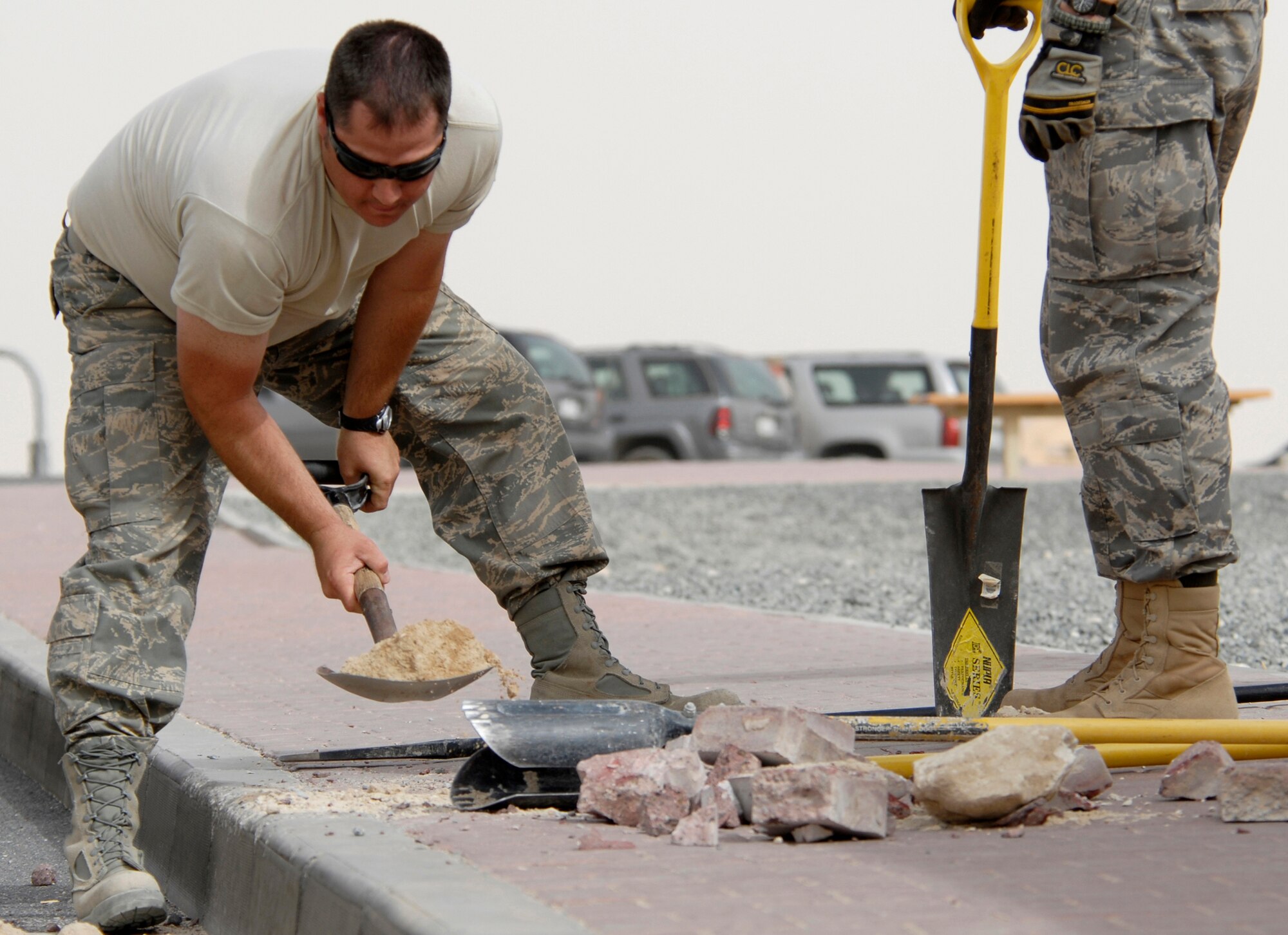 SOUTHWEST ASIA -- Technical Sgt. Dirk Mancuso, deployed to the 386th Expeditionary Civil Engineer Squadron, shovels dirt out of a hole for a new traffic bollard May 21, 2008, at an air base in the Persian Gulf Region. Members from the 386th ECES are installing new traffic bollards to improve force protection on the air base. Sergeant Mancuso is deployed from the Louisiana Air National Guard’s 159th Fighter Wing in New Orleans. (U.S. Air Force photo/ Staff Sgt. Patrick Dixon)