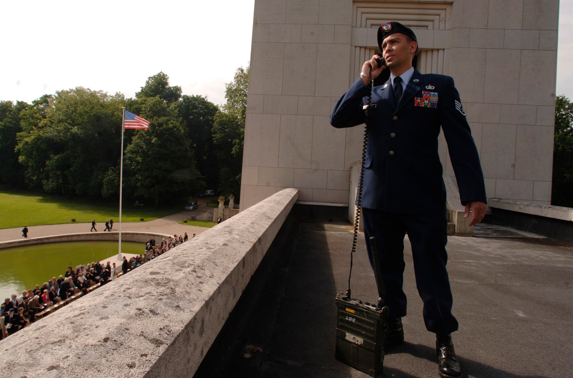 Minutes prior to the start of the Lafayette Escadrille memorial ceremony near Paris May 24, Staff Sgt. Jason Nieves, a joint terminal air controller, prepares to coordinate a fly-over of F-16 Fighting Falcons and French Mirages. Several hundred French and American citizens paid homage to the United States' first combat aviators, an all-American squadron of volunteers who flew under the French flag during World War I, where many gave their lives in defense of French democracy. (U.S. Air Force photo/Master Sgt. Scott Wagers)