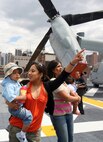 Visitors aboard the USS Kearsarge get a first hand look at various helicopters used by the Marine Corps May 24.