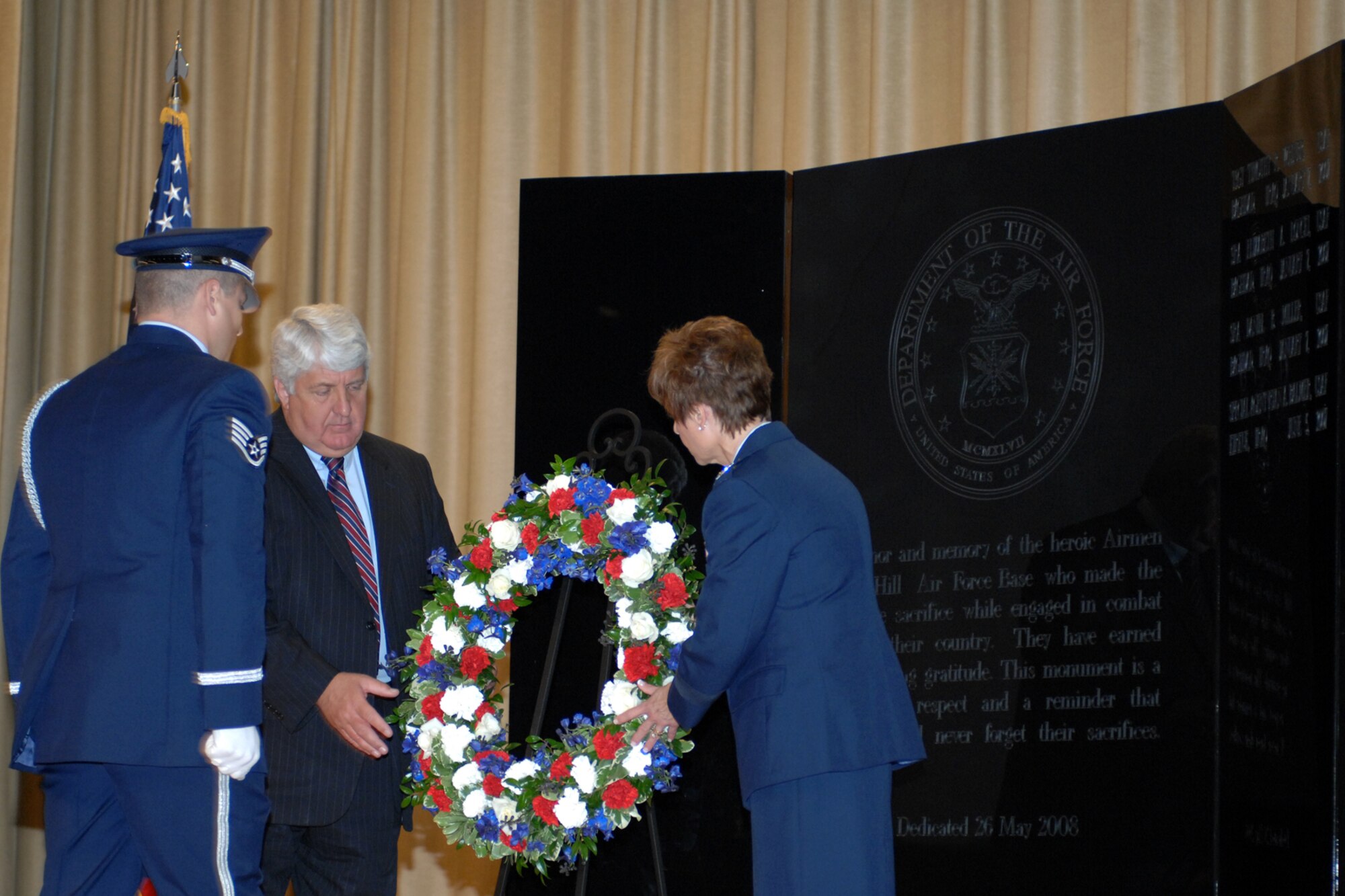 U.S. Rep. Rob Bishop (center) and Maj. Gen. Kathleen Close, Ogden Air Logistics Center commander, place a Memorial Day Wreath during a ceremony held to dedicate the new Hill Memorial Park for the fallen Airmen of Hill Air Force Base. (U.S. Air Force Photo by James Arrowood)