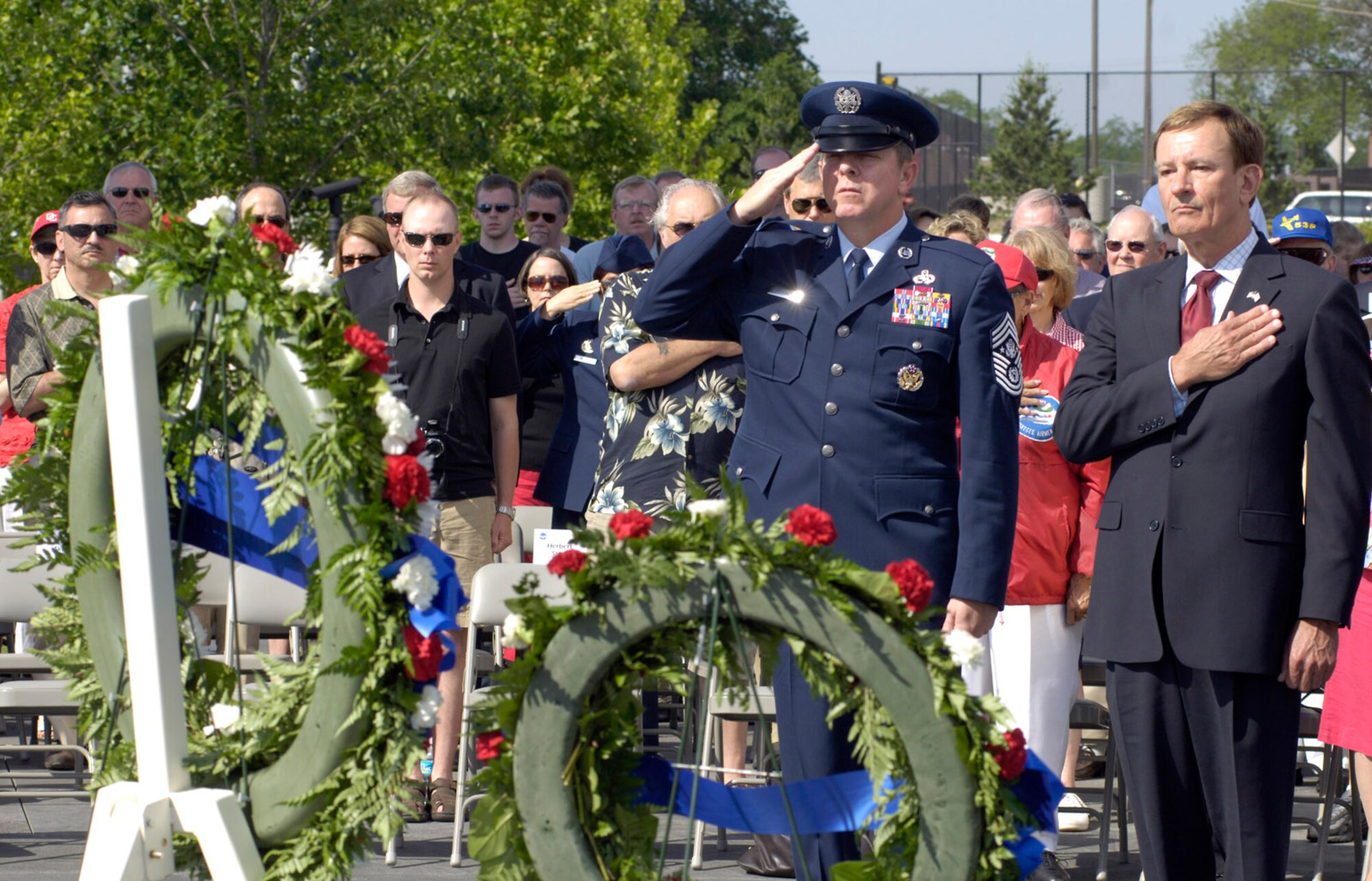 During a Memorial Day wreath-laying ceremony  at the Air Force Memorial Chief Master Sergeant of the Air Force Rodney J. McKinley (second from right) pays tribute to the more than 55,000 Airman, since World War I, who have given their lives in service to their country, Washington, D.C., May 26, 2008. The ceremony was co-sponsored by the Air Force Association and Air Force Sergeants Association. (U.S. Air Force photo by Master Sgt. Jim Varhegyi)


