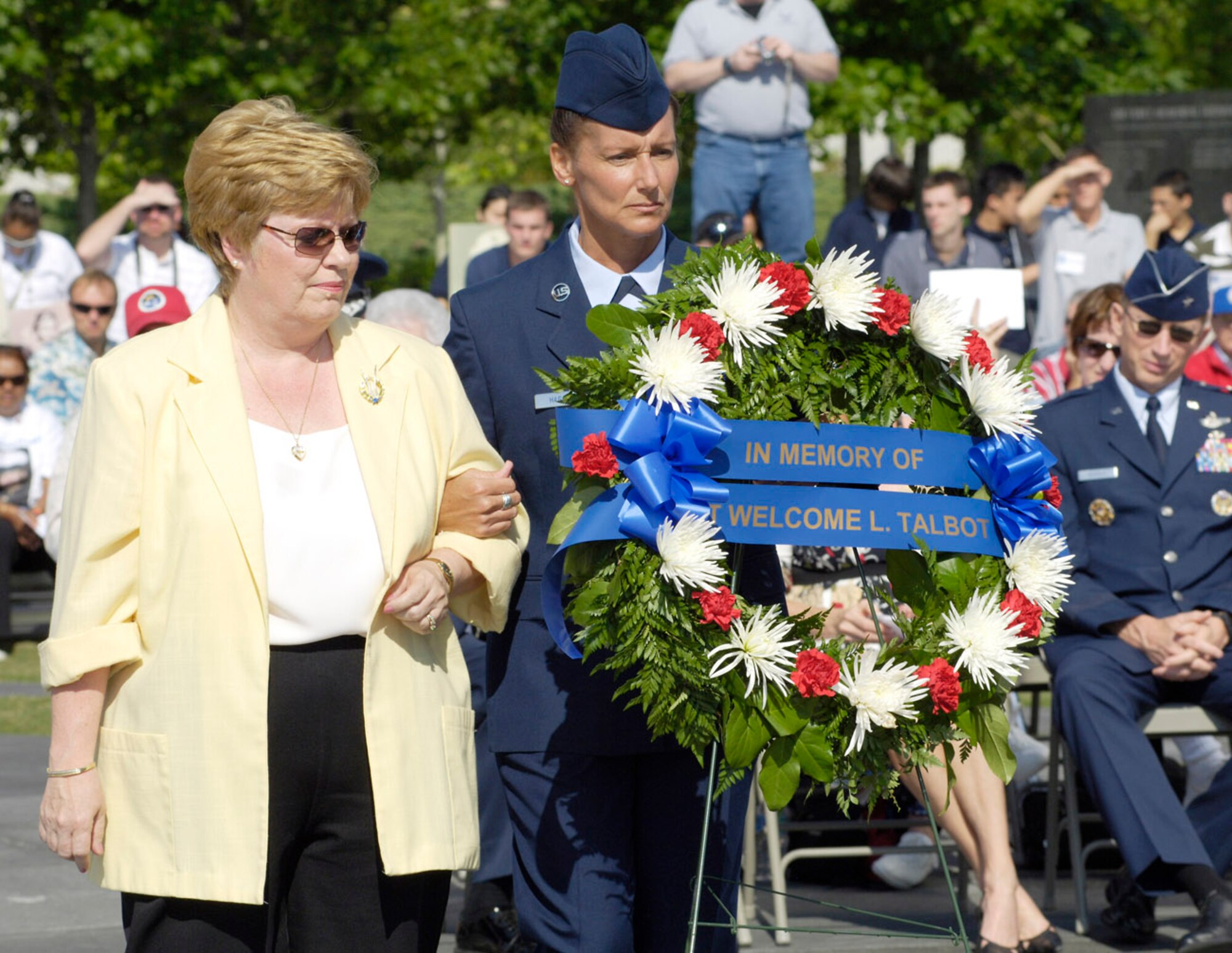Ms. Lindquist is escorted by Chief Master Sergeant Lisa Haggett during a Memorial Day Wreath-laying ceremony  at the Air Force Memorial, Washington, D.C., May 26, 2008. Ms. Lindquist laid a wreath in honor of her uncle Sgt. Welcome L. Talbot who served during World War Two. Sergeant Haggett is stationed at Andrews Air Force Base as the superintendent for the 316th Mission Support Squadron. The ceremony was co-sponsored by the Air Force Association and Air Force Sergeants Association. (U.S. Air Force photo by Master Sgt. Jim Varhegyi)(released)

