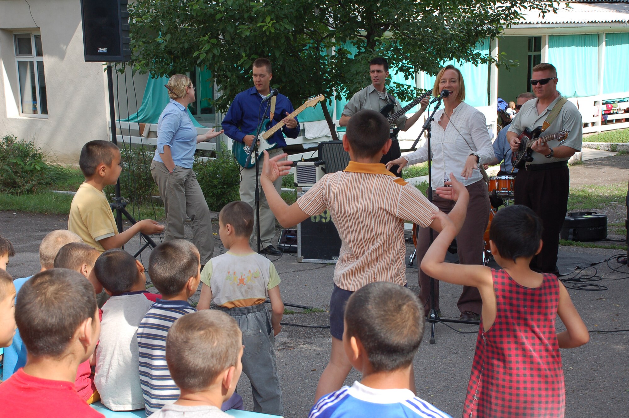 (08/05/25) MANAS AB, KYRGYZSTAN -- U.S. Air Forces Central Band Thunder Roll, performs at the Belovodosky Orphanage.  The AFCENT band performed at the orphanage and explained the different instruments the band uses during their visit.  (U.S. Air Force/TSgt Jerome Baysmore/ Released)