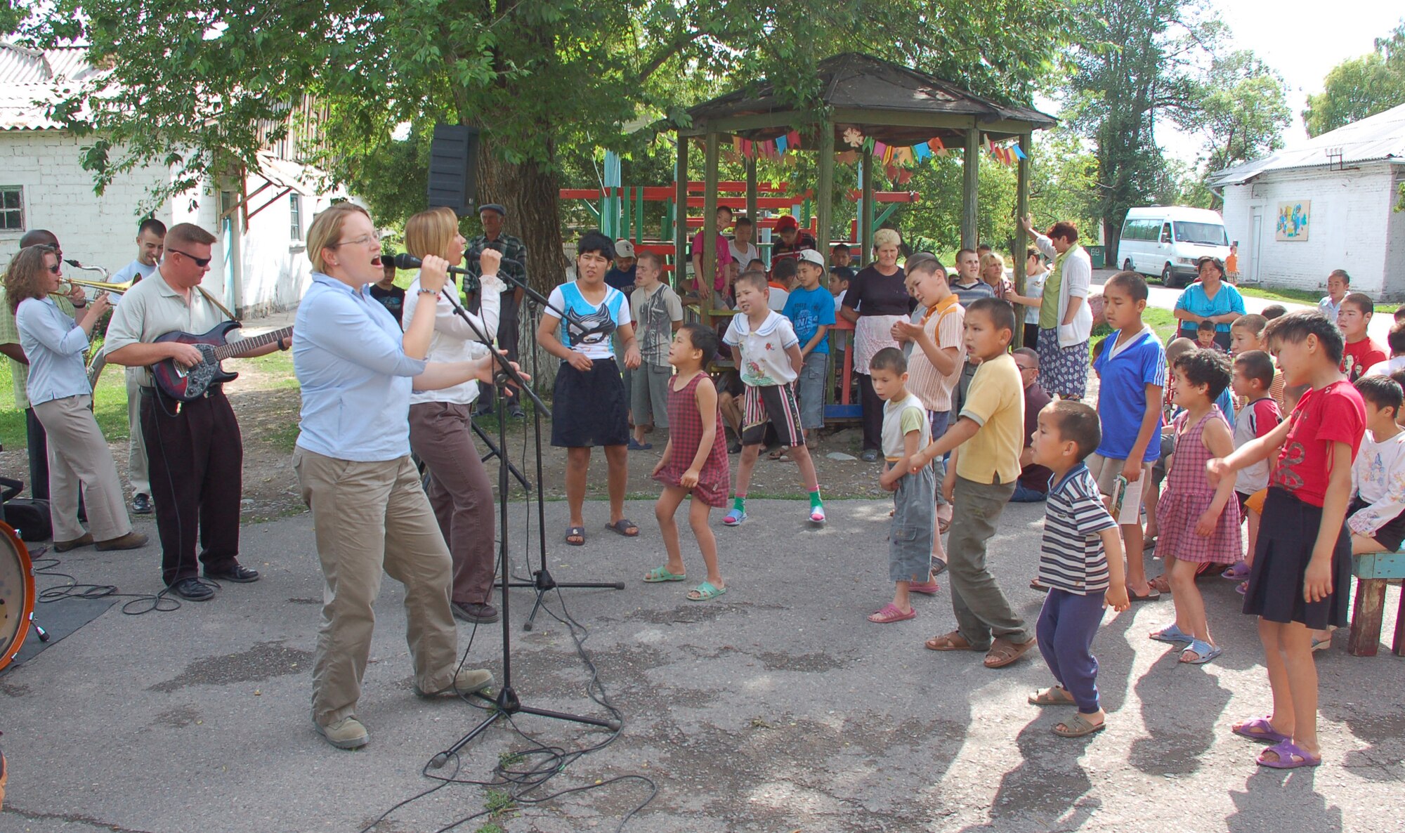 (08/05/25) MANAS AB, KYRGYZSTAN -- U.S. Air Forces Central Band Thunder Roll, performs at the Belovodosky Orphanage.  The AFCENT band performed at the orphanage and explained the different instruments the band uses during their visit.  (U.S. Air Force/TSgt Jerome Baysmore/ Released)