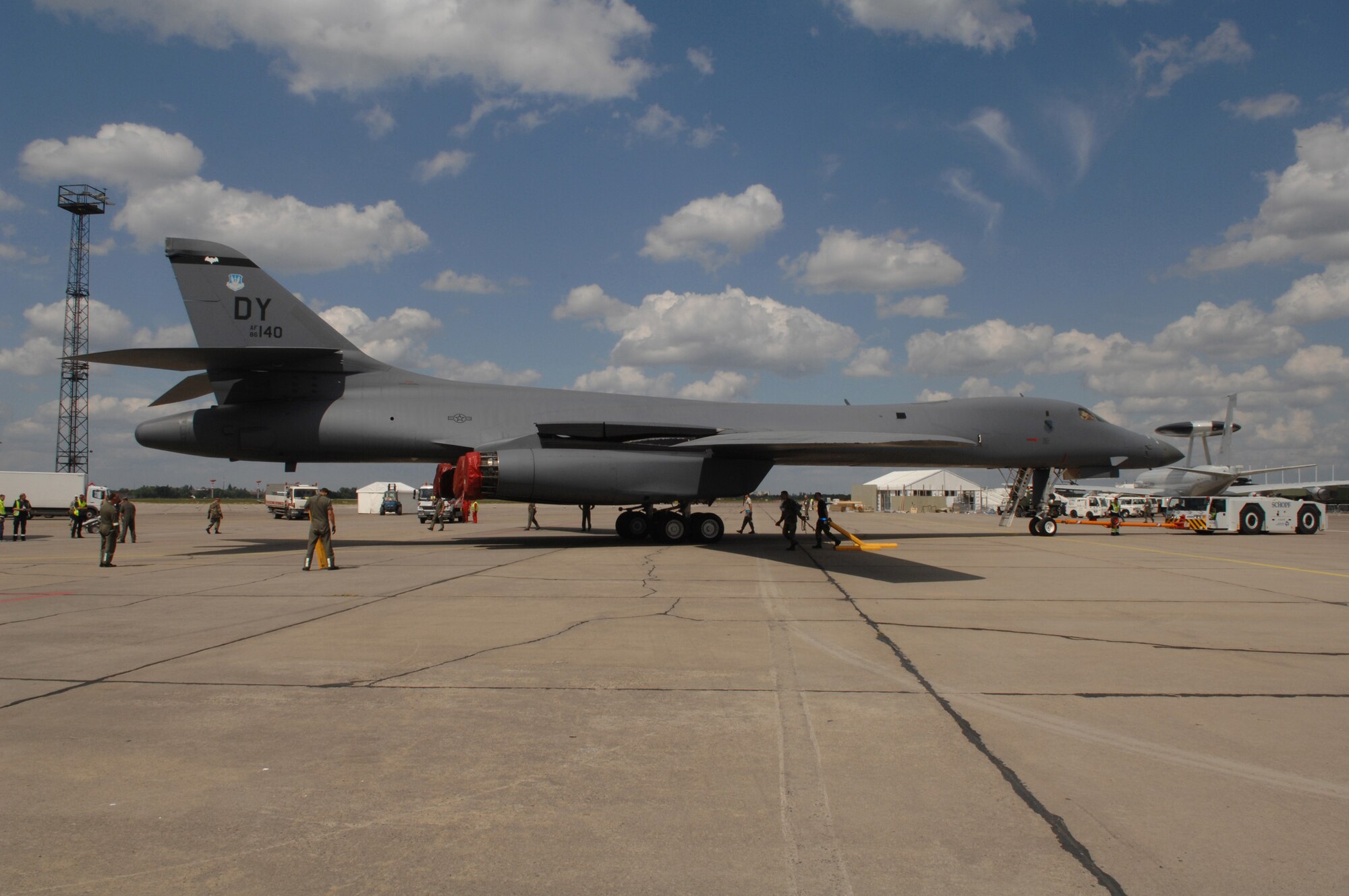BERLIN, Germany - Schoenefeld Airport contractors tow a B-1B Lancer bomber aircraft into place for preparation of the 2008 Berlin Air Show here May 24.  The B-1B and it's aircrew and maintenence personnel are based at the 7th Bomb Wing, Dyess Air Force Base, TX. (U.S. Air Force photo by Tech. Sgt. Corey Clements)