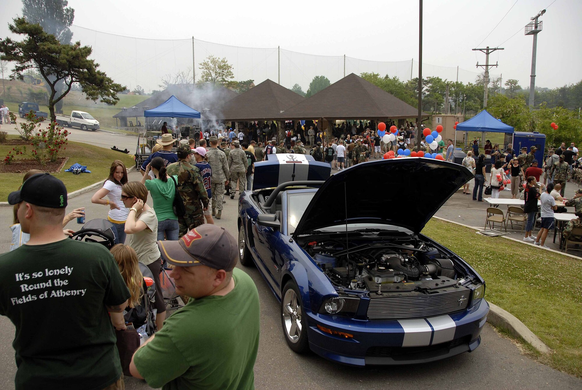 OSAN AIR BASE, Republic of Korea -- 51st Fighter Wing Mustangs stand in line for hotdogs and hamburgers during the 101 Critical Days of Summer burger burn May 23. The Air Force’s 101 Critical Days of Summer, which began Memorial Day weekend and ends Labor Day weekend, is traditionally a period of time when the Air Force experiences an increased number of off-duty injuries caused by increased outdoor activity and risk taking. (U.S. Air Force photo/Senior Airman Christopher Boitz)