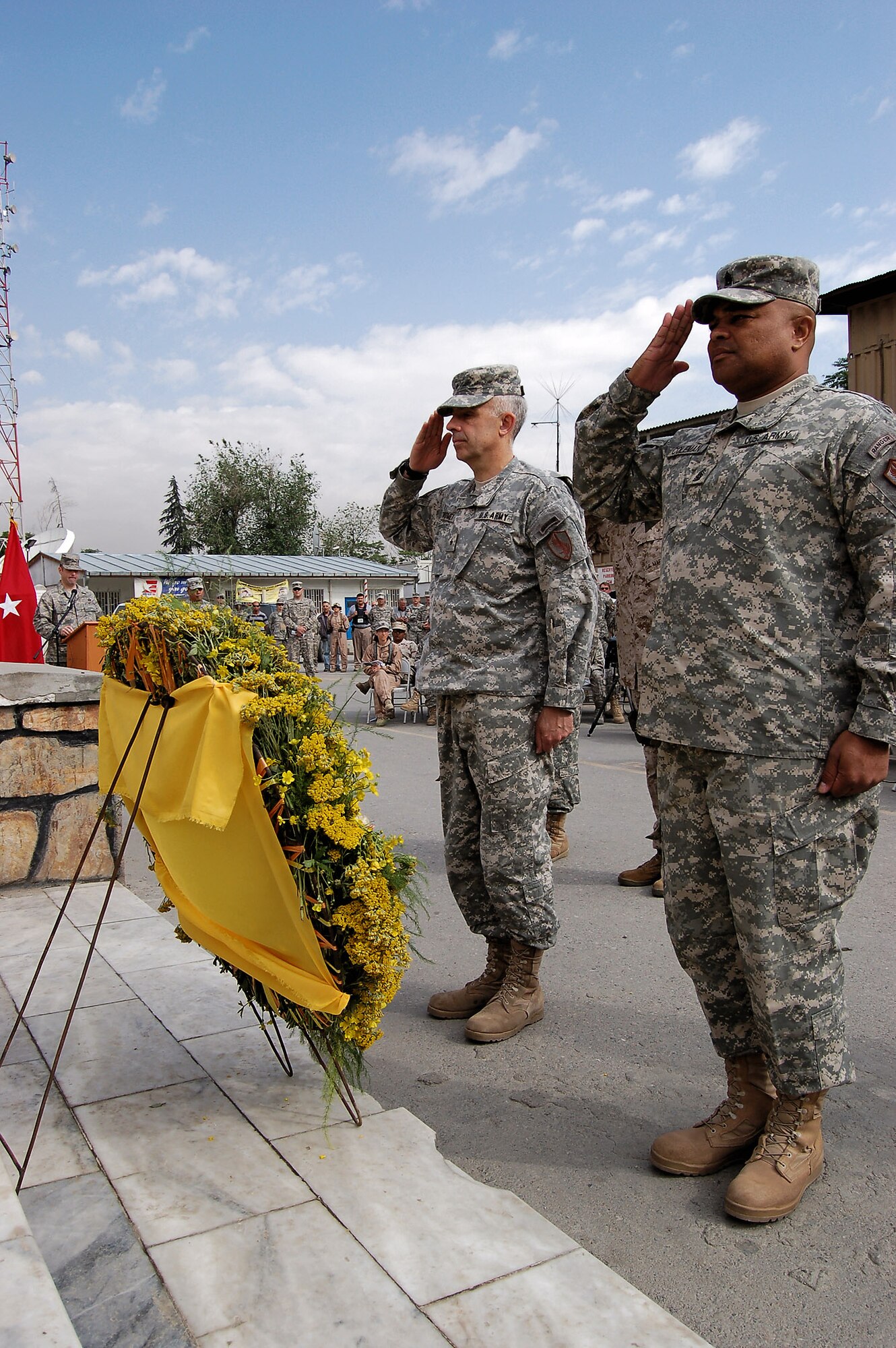 Army Brig. Gen. Andrew B. Twomey (left), Combined Security Transition Command-Afghanistan deputy commanding general, and Command Sgt. Maj. Arthur L. Coleman, CSTC-A command sergeant major, salute the colors in a Memorial Day ceremony May 26 at Camp Eggers in Kabul, Afghanistan. The Memorial Day service was dedicated to the remembrance of fallen servicemembers, particularly the 62 CSTC-A comrades who gave their lives in service to their country. (U.S. Air Force photo/Staff Sgt. Beth Del Vecchio)
