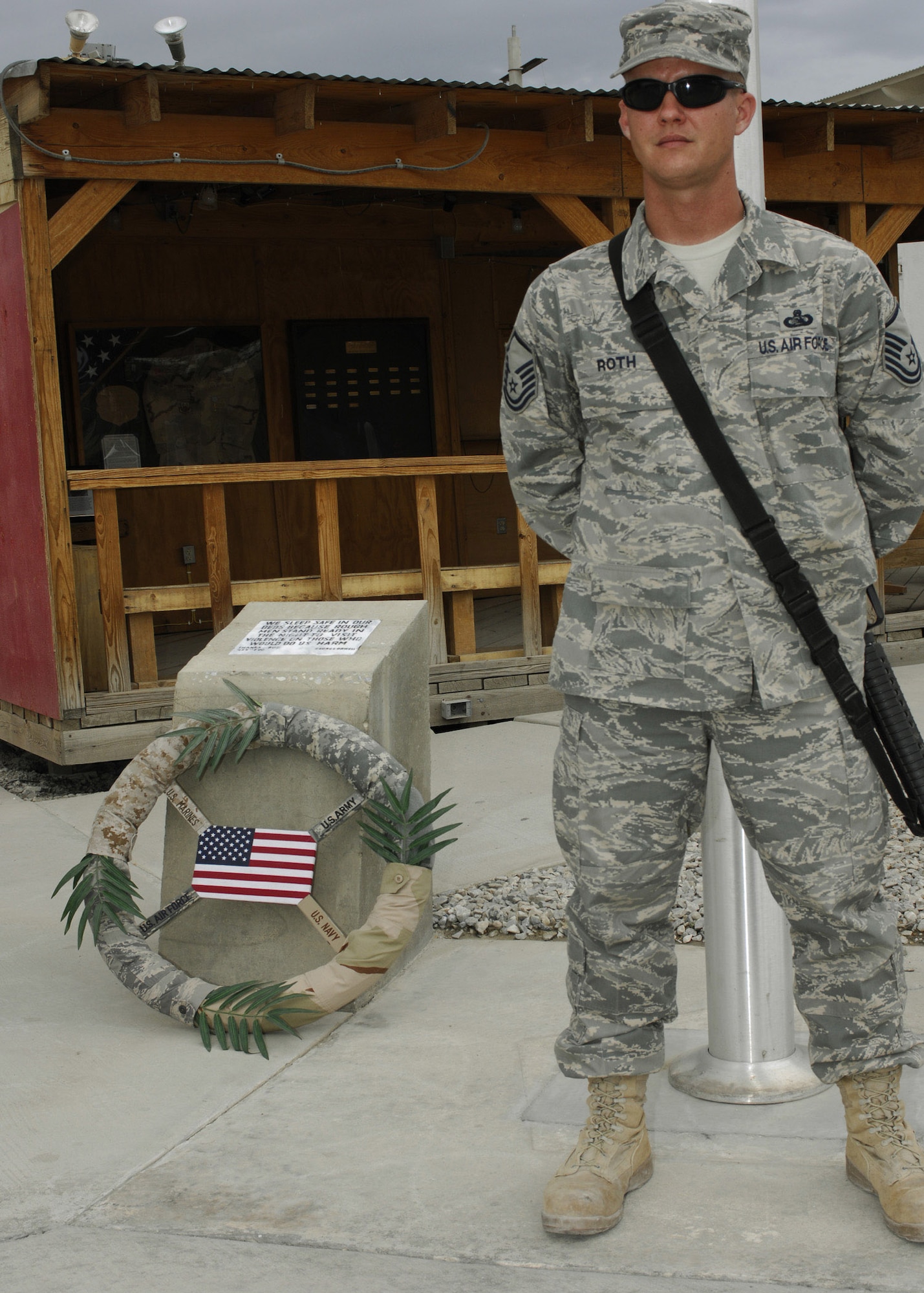 Master Sgt. Jerrod Roth stands watch during the 11-hour silent vigil at Bagram Air Base, Afghanistan, May 26. More than 130 Airmen and one civilian guarded the wreath laid at the camp's flag pole from 7:30 a.m. to 6:30 p.m., in honor of those who gave the ultimate sacrifice. Sergeant Roth is deployed to the 455th Expeditionary Force Support Squadron. (U.S. Air Force photo/Capt. Toni Tones)