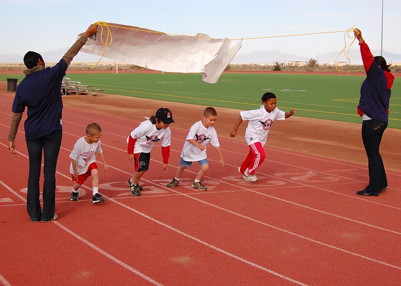 Children from Holloman Air Force Base, N.M., begin a one mile run for America's Kids Run at the base fitness center,  May 17. America's Kids Run celebrated its 23rd year as the largest children's running event worldwide through participation on military bases here and abroad. (U.S. Air Force photo/Airman 1st Class Michael Means)