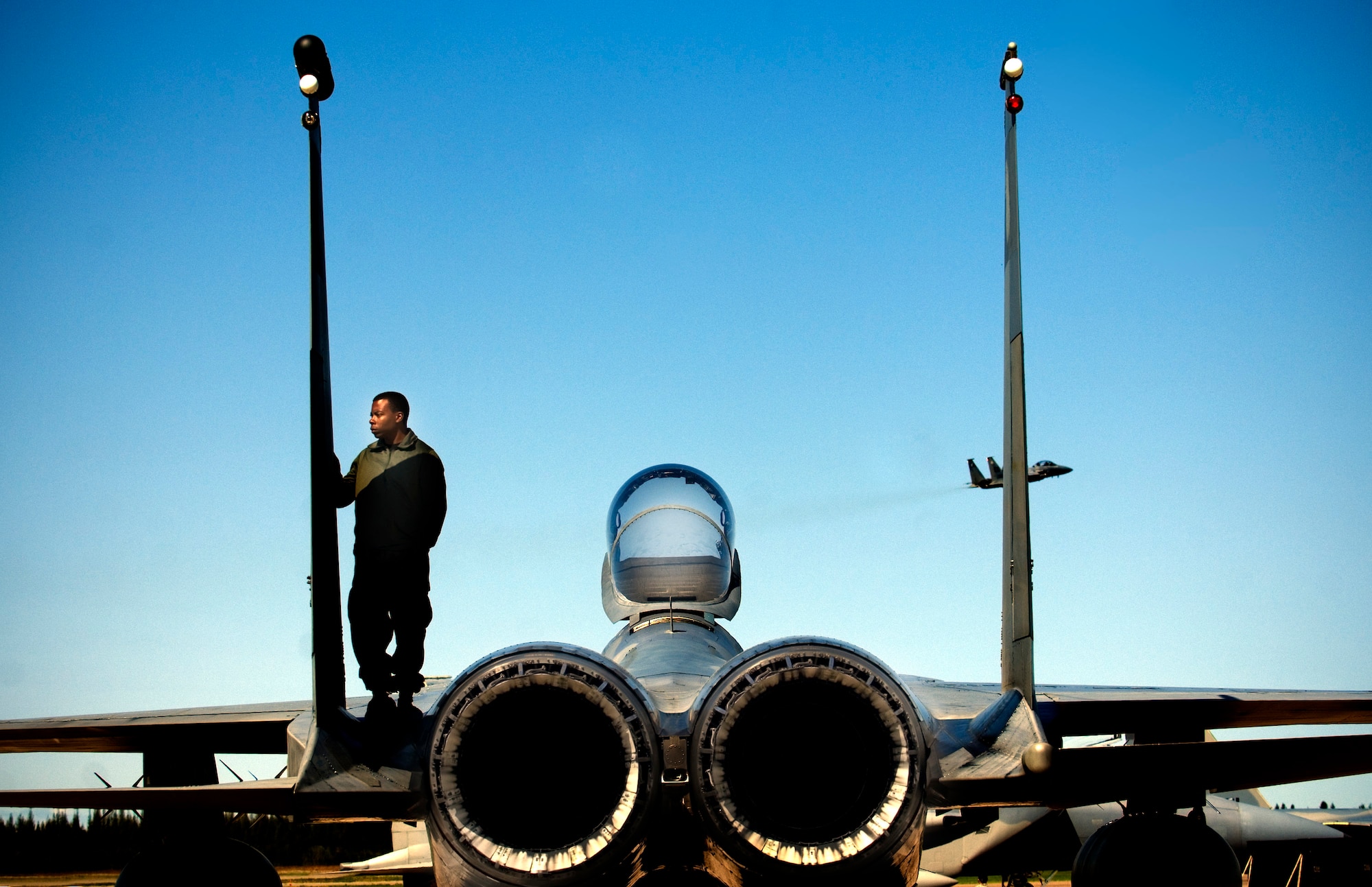 Staff Sgt. Chester Johnson, from Eglin Air Force Base, Fla., performs a post flight inspection on an F-15C Eagle during a Maple Flag exercise at Cold Lake, Canada. Maple Flag 41 is a four-week international air combat exercise held annually at 4 Wing Cold Lake, Alberta, Canada. The exercise provides Canadian and allied aircrew with realistic training in a modern simulated air combat environment, and it emphasizes air operations involving large package coalition forces. (U.S. Air Force photo/Master Sgt. Cecilio Ricardo) 