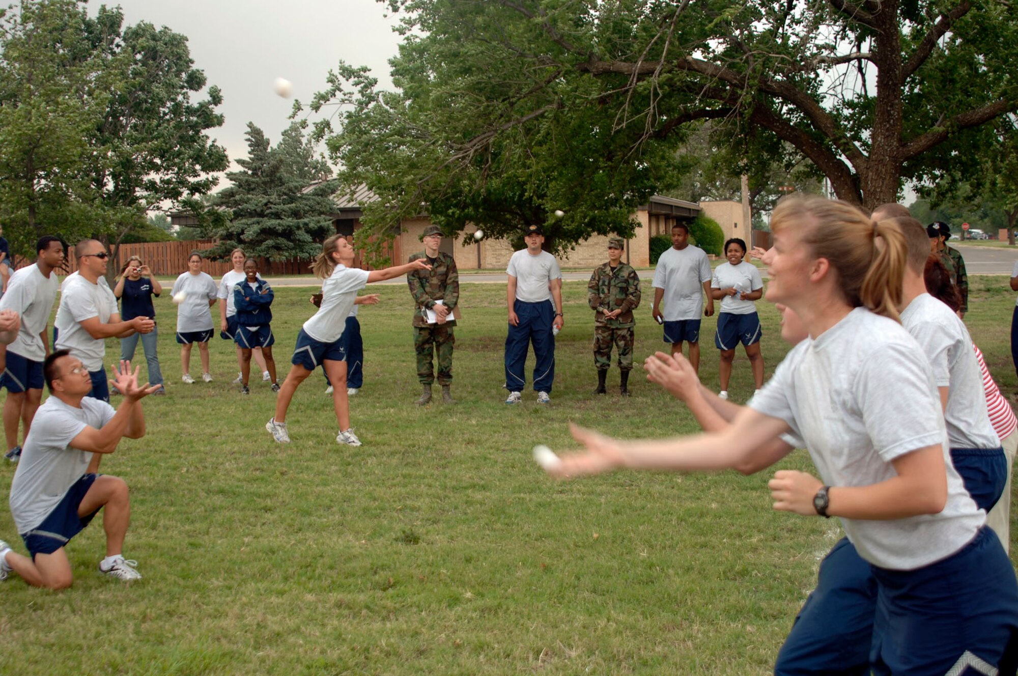 ALTUS AIR FORCE BASE, Okla. -- Participants compete for first place points at Egg Toss events during Altus AFB's first Sports Day at the Base Parade Grounds May 23. The 97th Force Support Squadron team for the event, Senior Airman Sadarius Wright and Staff Sgt. John Inman, won first place. (U.S. Air Force photo/Senior Airman Clinton Atkins)