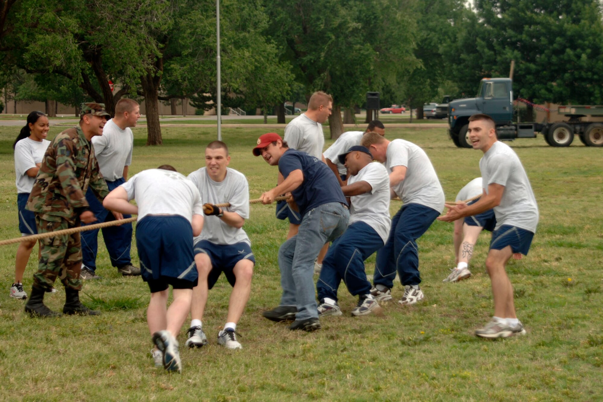 ALTUS AIR FORCE BASE, Okla. -- The 97th Communications Squadron team competes in the Tug-a-War contest during Altus AFB's first Sports Day at the Base Parade Grounds May 23. The 97 CS team were runners-ups for Tug-a-War. Sports Day marked the first day of 101 Critical Days of Summer. The 97th Logistics Readiness Squadron team won first place honors for Sports Day with a total of 150 points. (U.S. Air Force photo/Senior Airman Clinton Atkins)