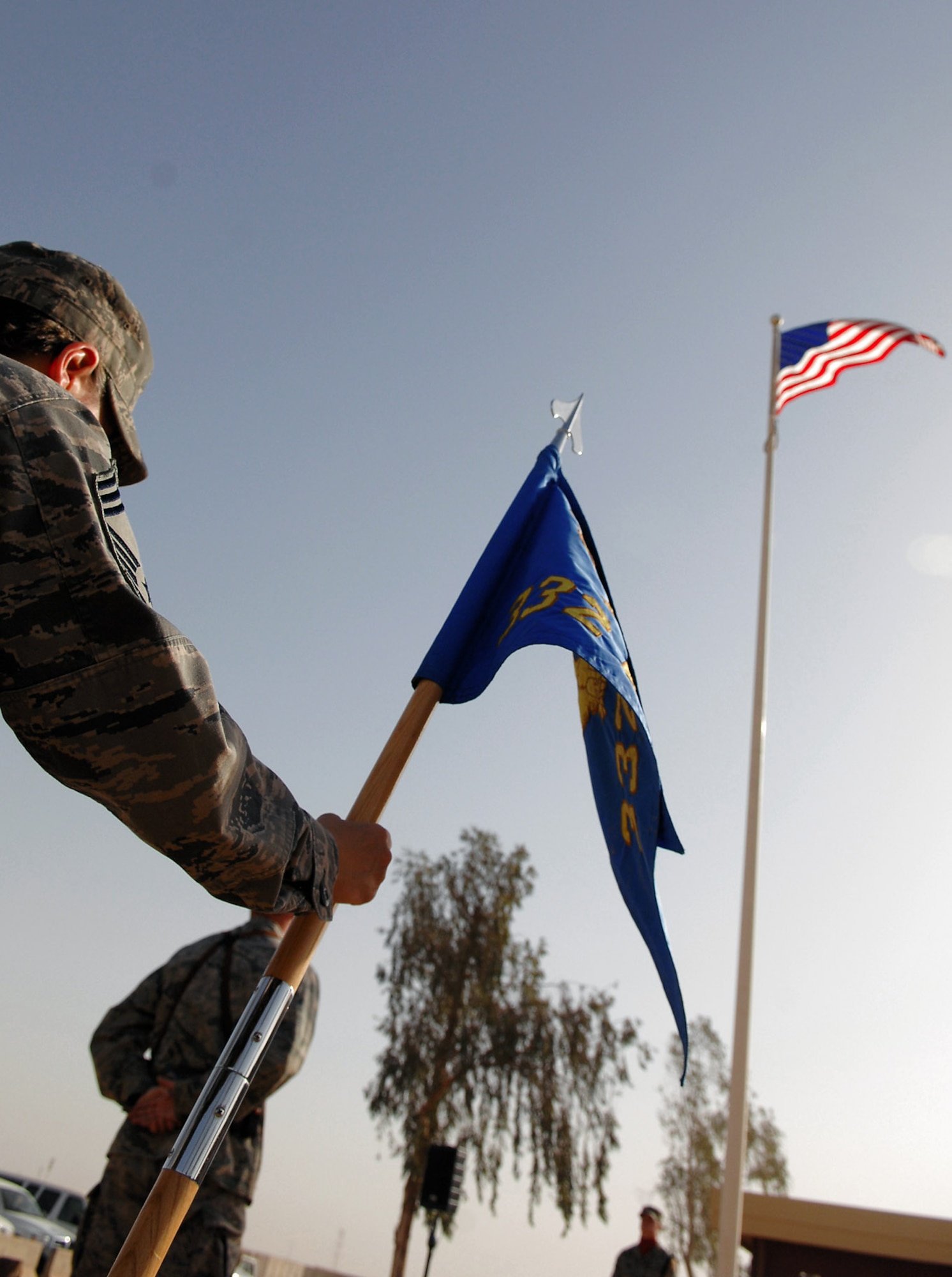 Airmen assigned to the 332nd Air Expeditionary Wing participate in a Memorial Day observance ceremony at Balad Air Base, Iraq, May 26. During the ceremony, the names of 44 Airmen assigned to the 332nd AEW who have died since 2003 were read. The list included the names of three Airmen who died this year. (U.S. Air Force photo/Senior Airman Julianne Showalter)